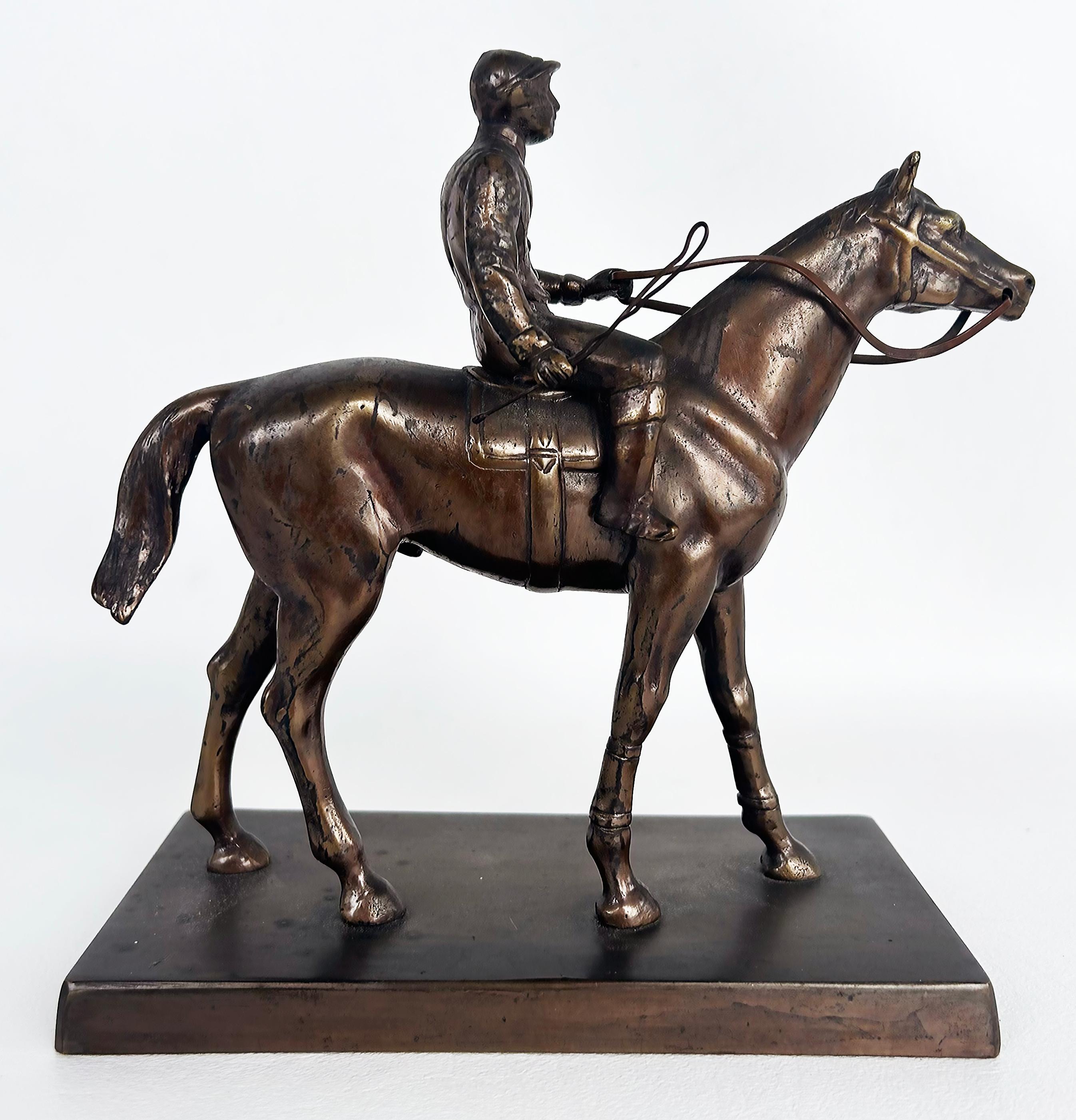 Equestrian Bronze Figurative Racehorse and Jockey Sculpture Statue

Offered for sale is an equestrian bronze figurative sculpture of a thoroughbred horse and jockey.  This is a well-made 20th-century sculpture but we have not found a signature.