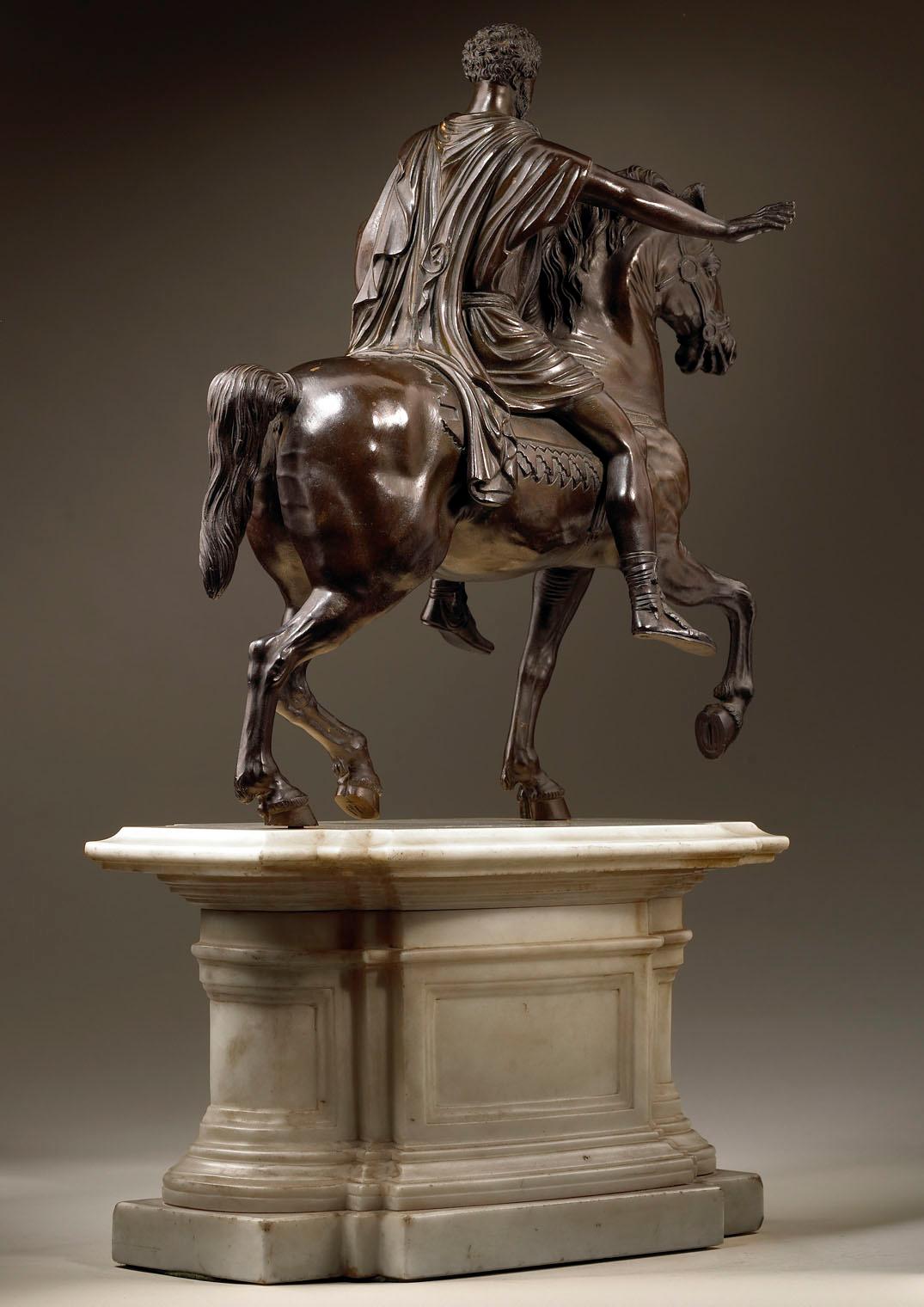 Equestrian Statue of Marcus Aurelius modeled after the antique in superb detail and raised on an architectural statuary marble base.
Italy, 18th century

Measures: Height 57cm
Height of bronze 37cm
Length 34cm
Depth 18cm.