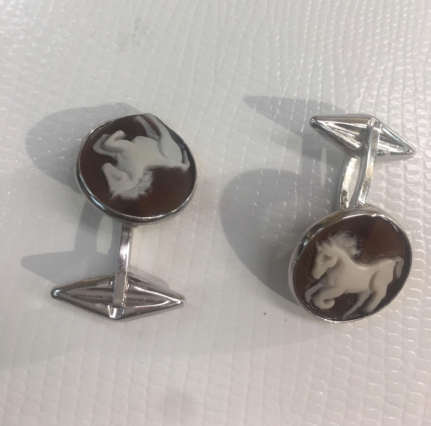 Exquisite Equestrian Galloping Horse Hand carved shell Cameo Cufflinks set in Sterling Silver; Beautiful Hand crafted design…made in Italy. The cufflinks measure approx. 16.5mm in diameter. Classic and Timeless…Quality jewelry that so fits today’s