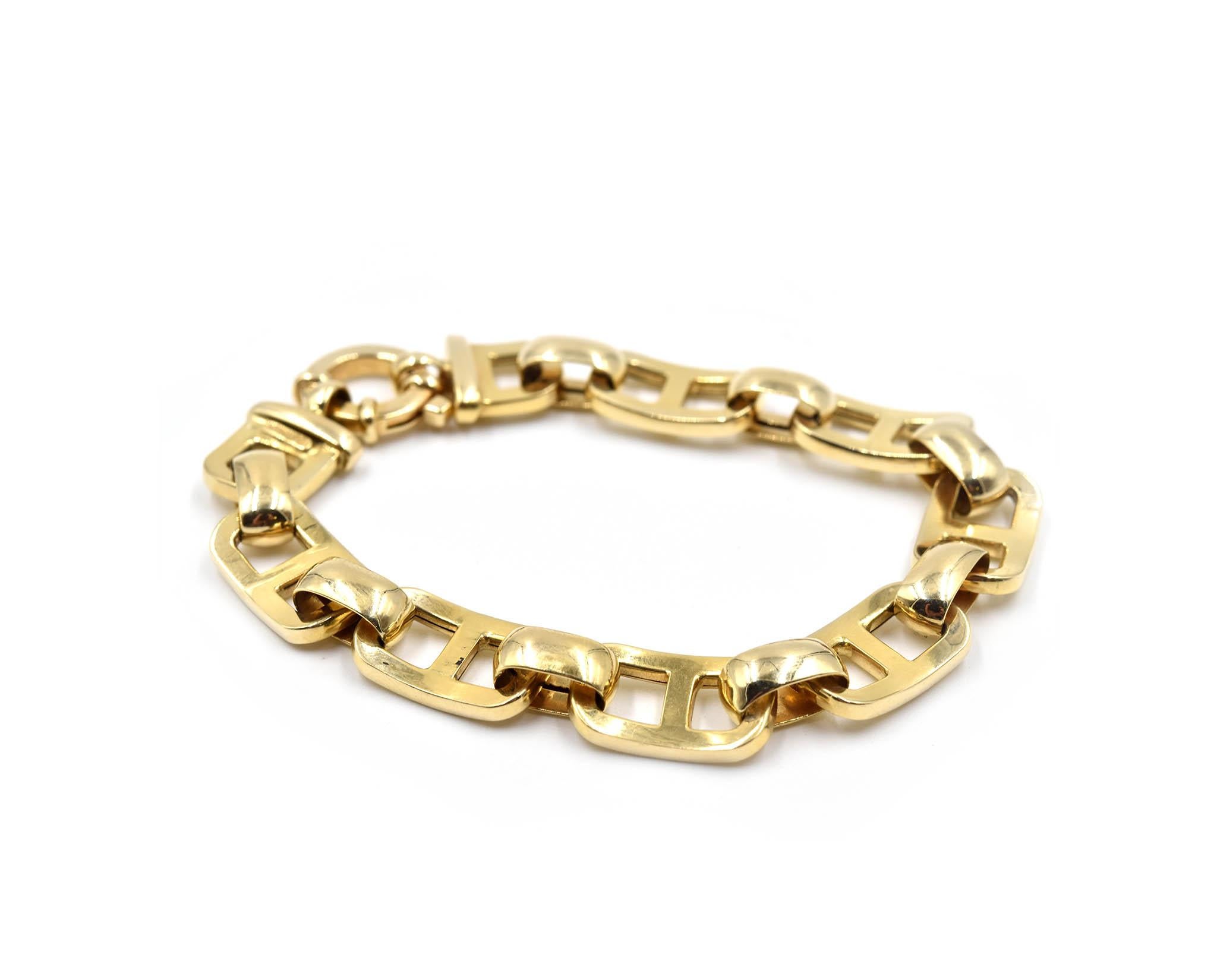 Designer: custom design
Material: 14k yellow gold
Dimensions: bracelet is 7-inch long x 3/8-inch wide
Weight: 16.1 grams
