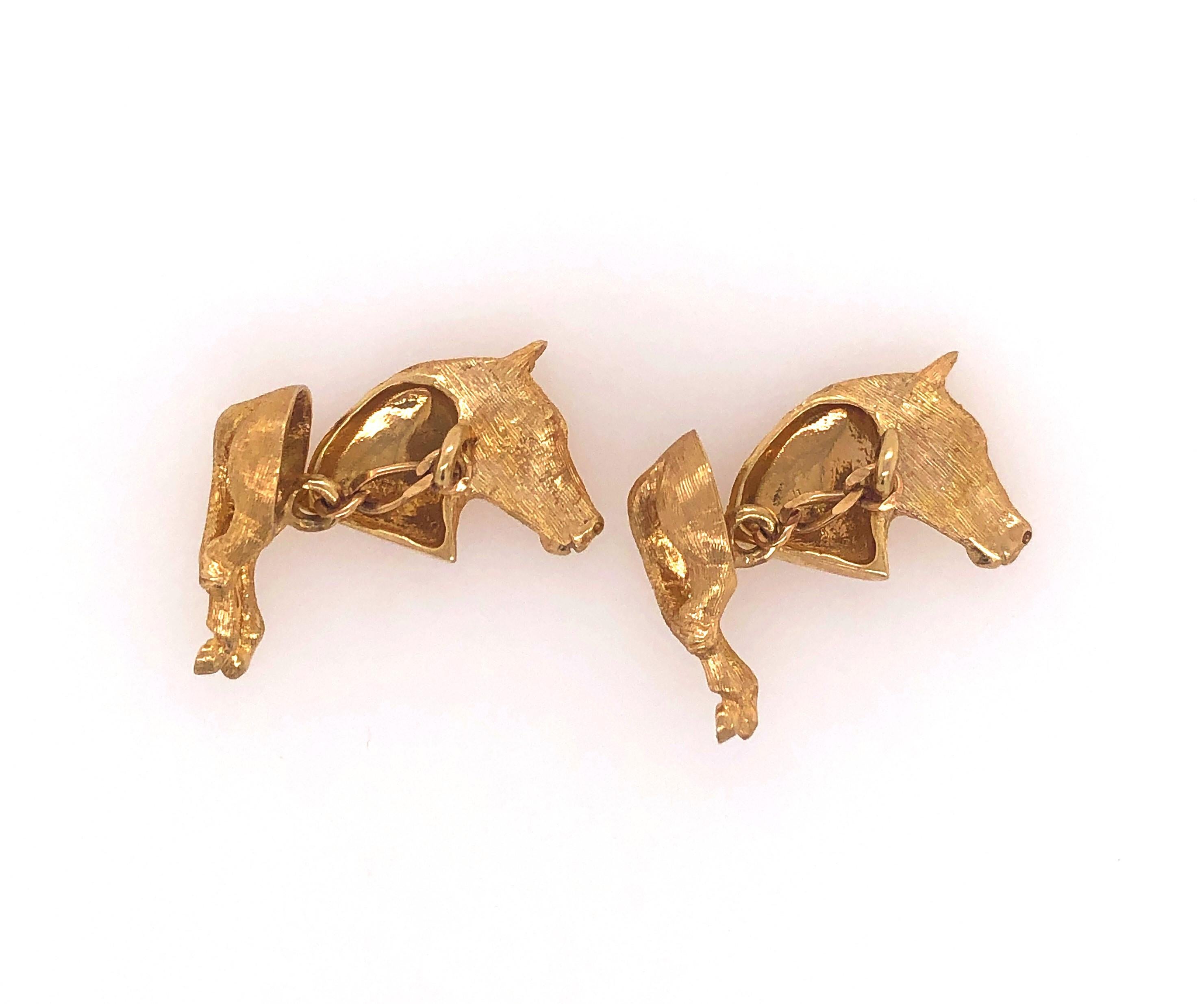 These curious horse head and hind quarters fourteen carat 14K yellow gold cuff links are sure to be a conversation starter!  In satin yellow gold with good detail, the horse head measures approximately 13.5 x 19.5 mm and has a diamond eye followed