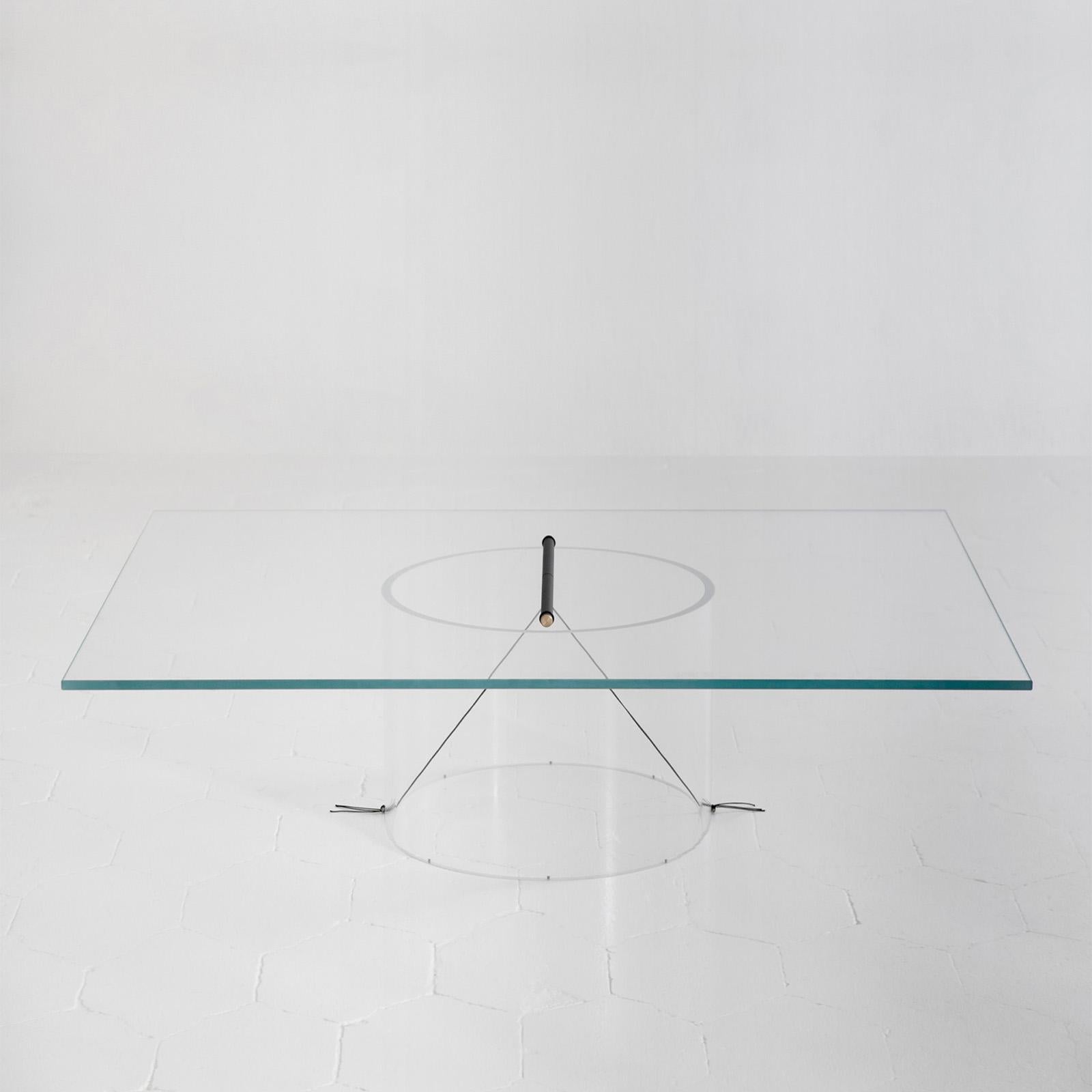 The core of the Equilibrium low table is represented by the transparency of its pure geometries, which allows for the central geometry of the connection to stand out, suspended in the middle. This configuration aims to make the structure disappear,