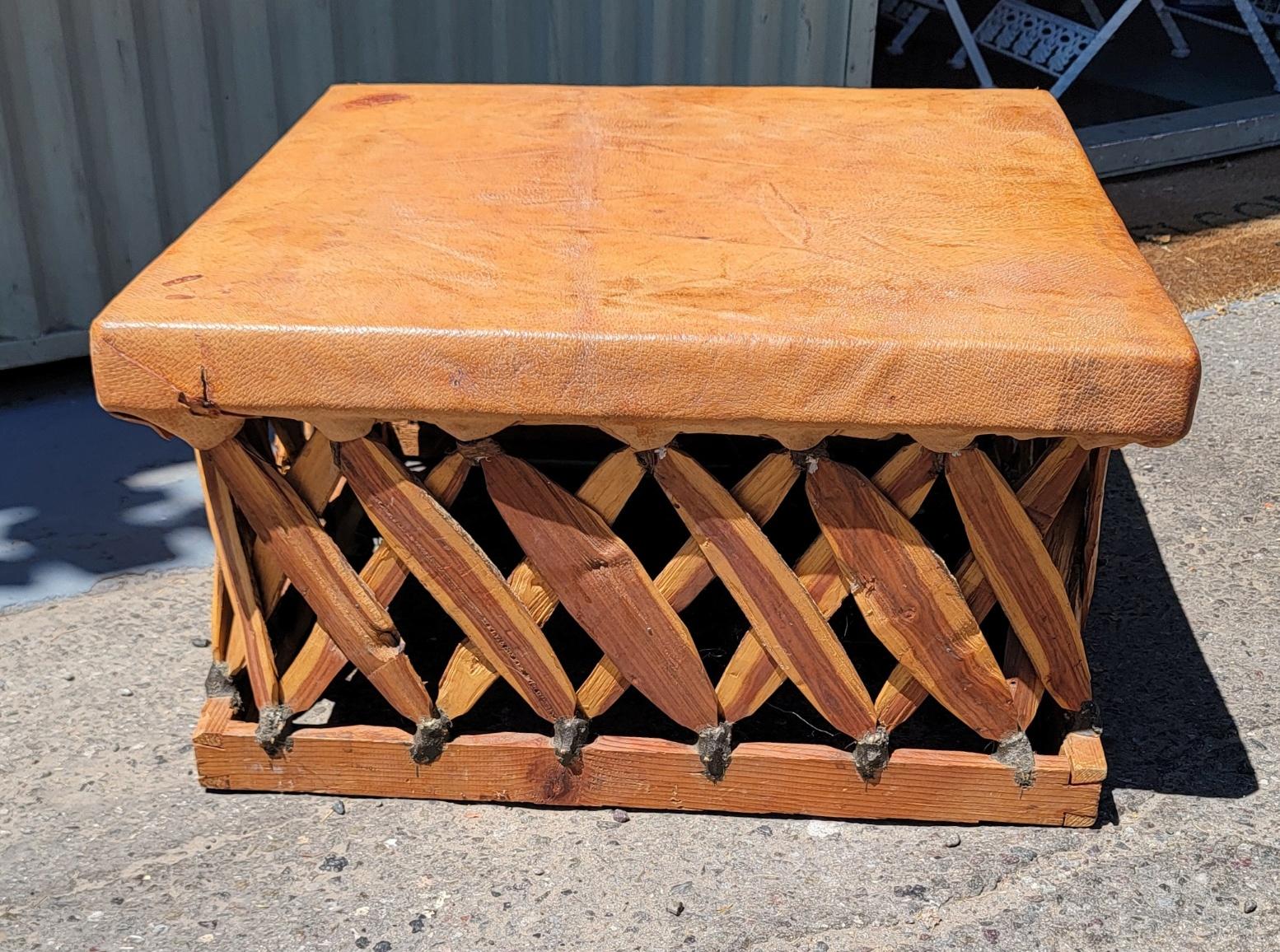 Amazing leather Equapaki table or ottoman with cedar wood base.These handmade tables are from Mexico and found with American Indian decor.