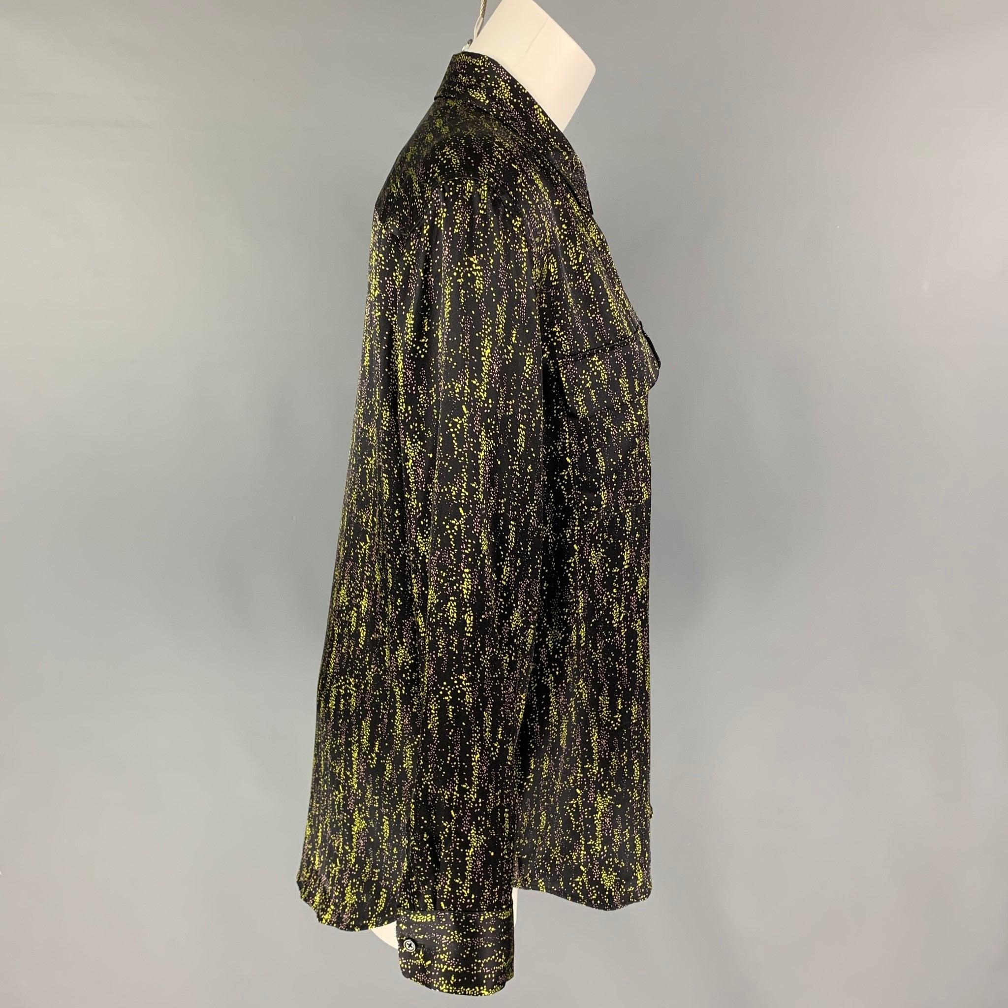 EQUIPMENT FEMME shirt comes in a black & green print silk featuring a spread collar, front flap pockets, and a button up closure.
Very Good
Pre-Owned Condition. 

Marked:   L  

Measurements: 
 
Shoulder: 18 inches  Bust: 44 inches  Sleeve: 25