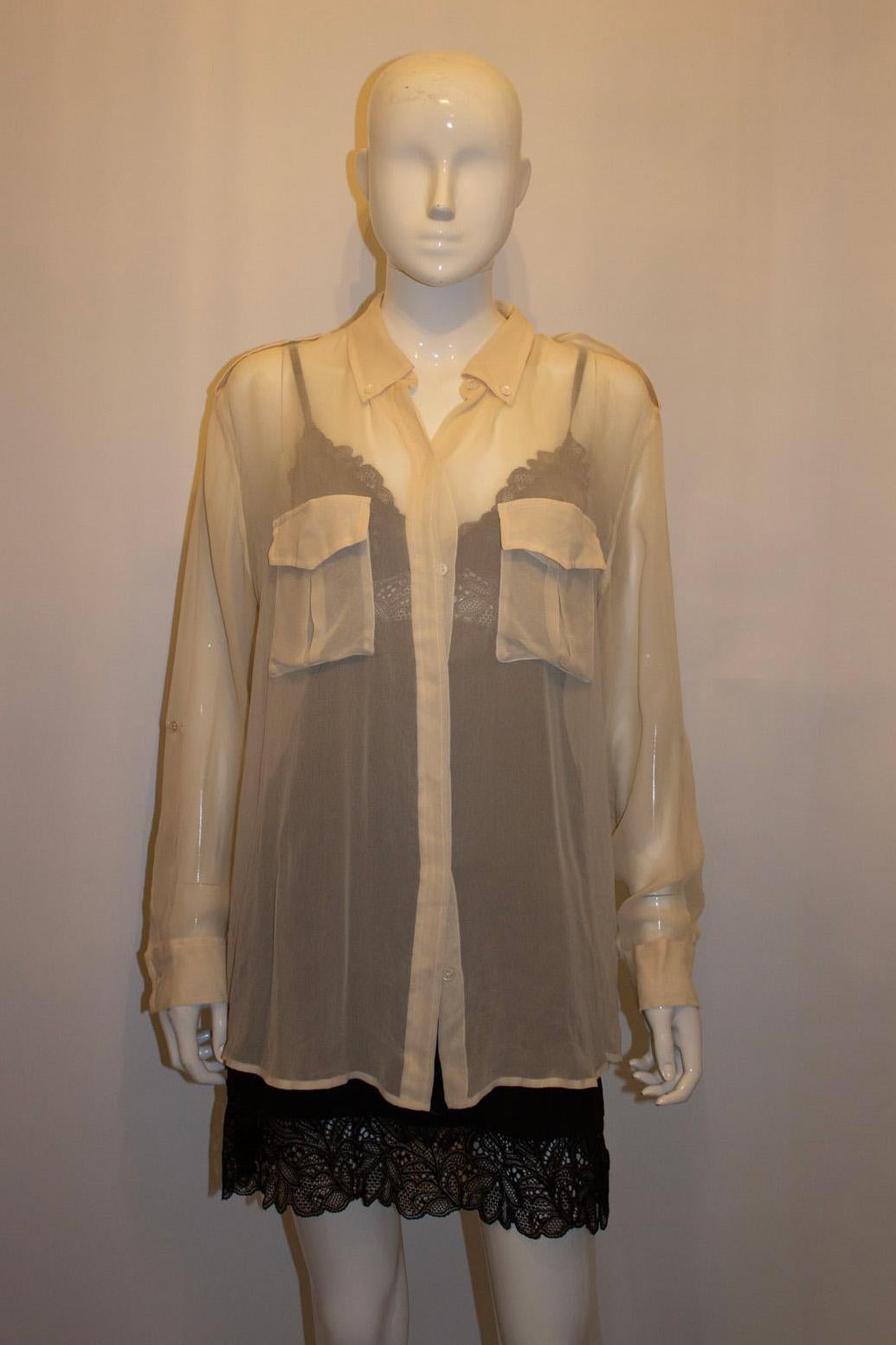 A stunning silk shirt by Equipment .  The shirt has two front pockets , sleaves that can be rolled and buttoned up and epaulets on the shoulders.
Size M Measurements: Bust up to 40'', length 29''