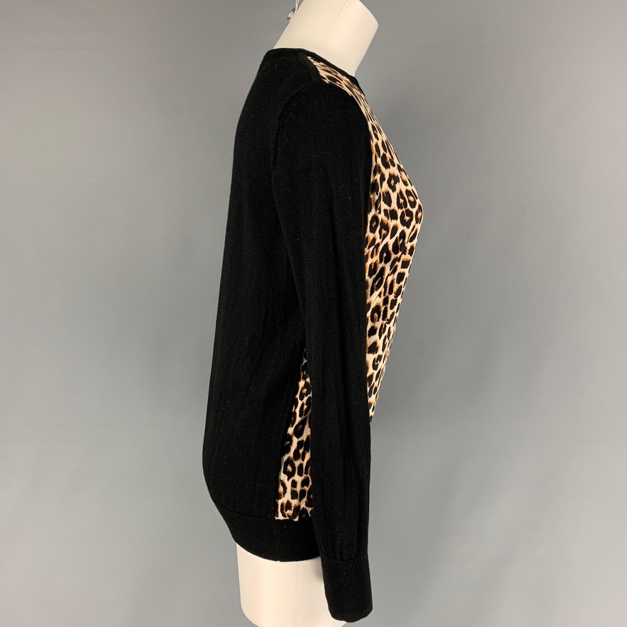 EQUIPMENT pullover comes in a black & tan leopard print featuring a crew-neck.
Very Good
Pre-Owned Condition. 

Marked:   M  

Measurements: 
 
Shoulder: 15.5 inches  Bust: 38 inches  Sleeve: 26.5 inches  Length: 25 inches 
  
  
 
Reference: