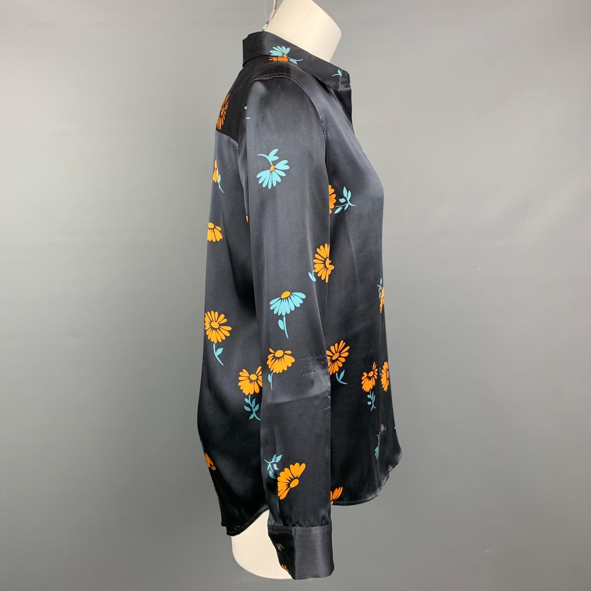 EQUIPMENT blouse comes in a navy & yellow floral silk featuring a pointed collar and a buttoned closure.

Very Good Pre-Owned Condition.
Marked: S

Measurements:

Shoulder: 16 in.
Bust: 38 in.
Sleeve: 24.5 in.
Length: 29 in. 