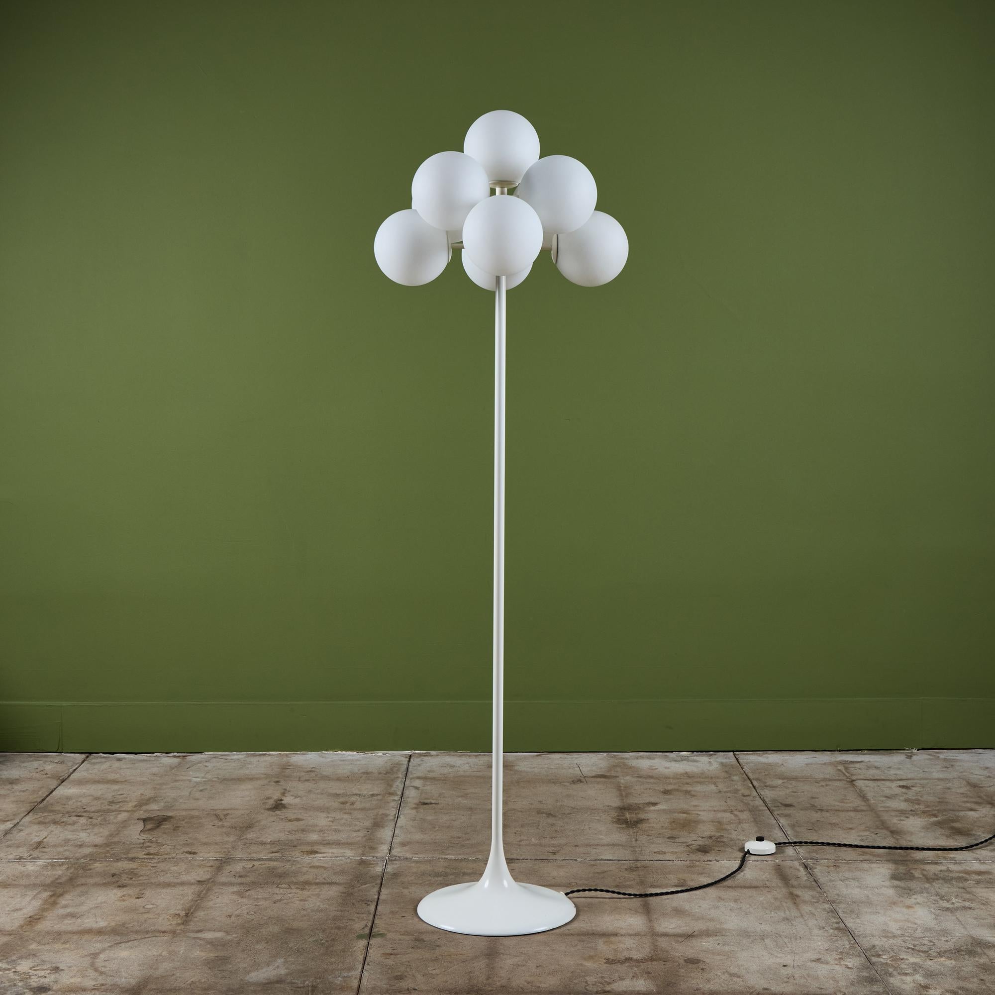 Commonly misattributed to Swiss architect and industrial designer Max Bill, this series of globe lamps - known as the “Figuration” line - were actually designed by Eva Renée Nele for German-Swiss lighting manufacturer Temde Leuchten. This example,