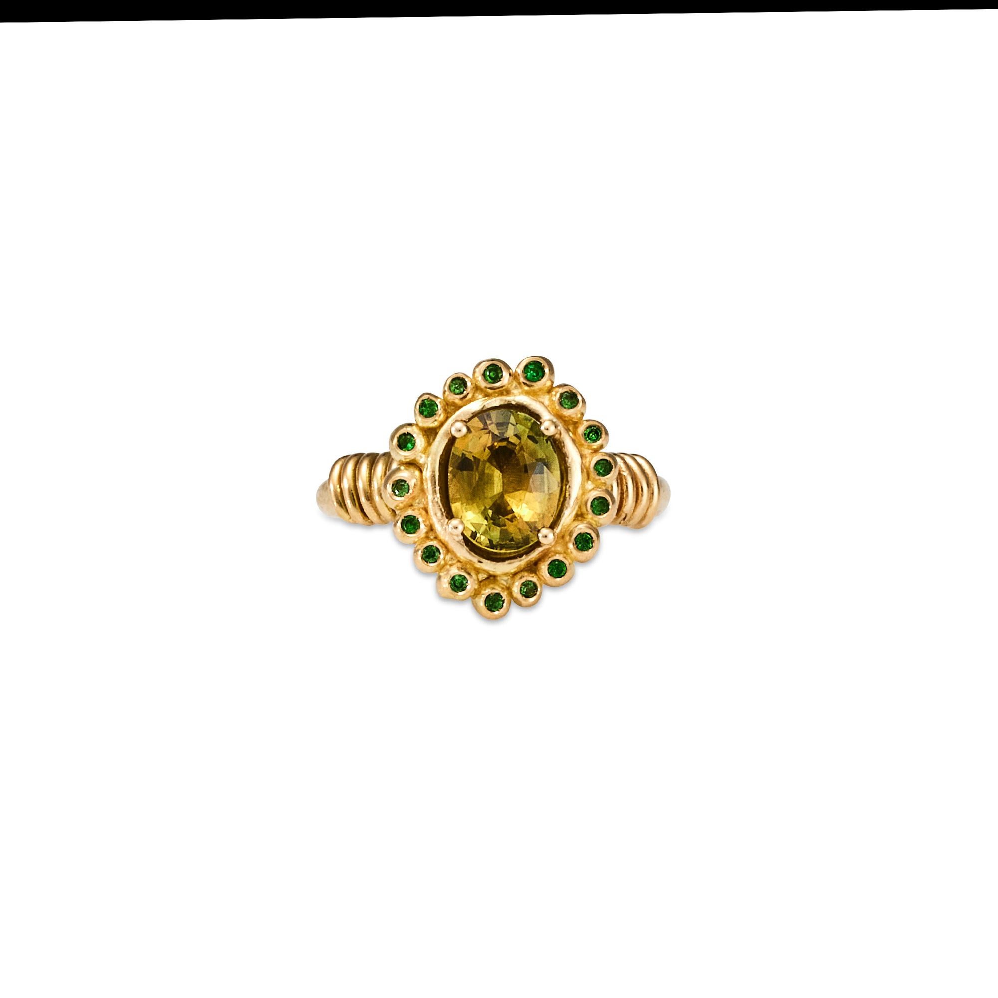 Eranthe Ring, 18 Karat Yellow Gold with Australian Yellow Sapphire and Tsavorite Garnets
Handcrafted and individually cast in solid gold. Olivia carves each piece from wax, making these items unique, which we believe is what gives them their beauty.