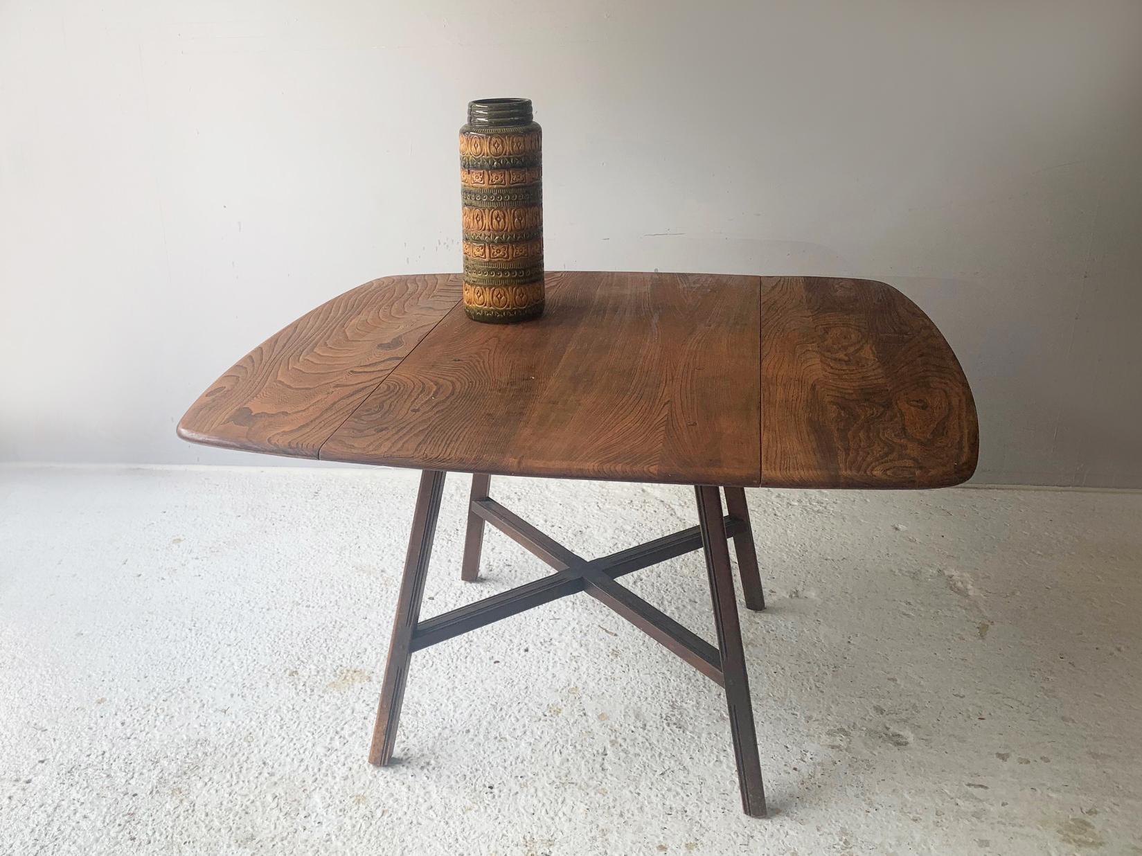 Designed by Lucian R Ercolani, the Ercol Old Colonial table is an earlier and rarer design than more recent Ercol tables. Produced in the 1960’s It has the ‘blue label’ which was only used between 1955 and 1975.  It is well used but in great