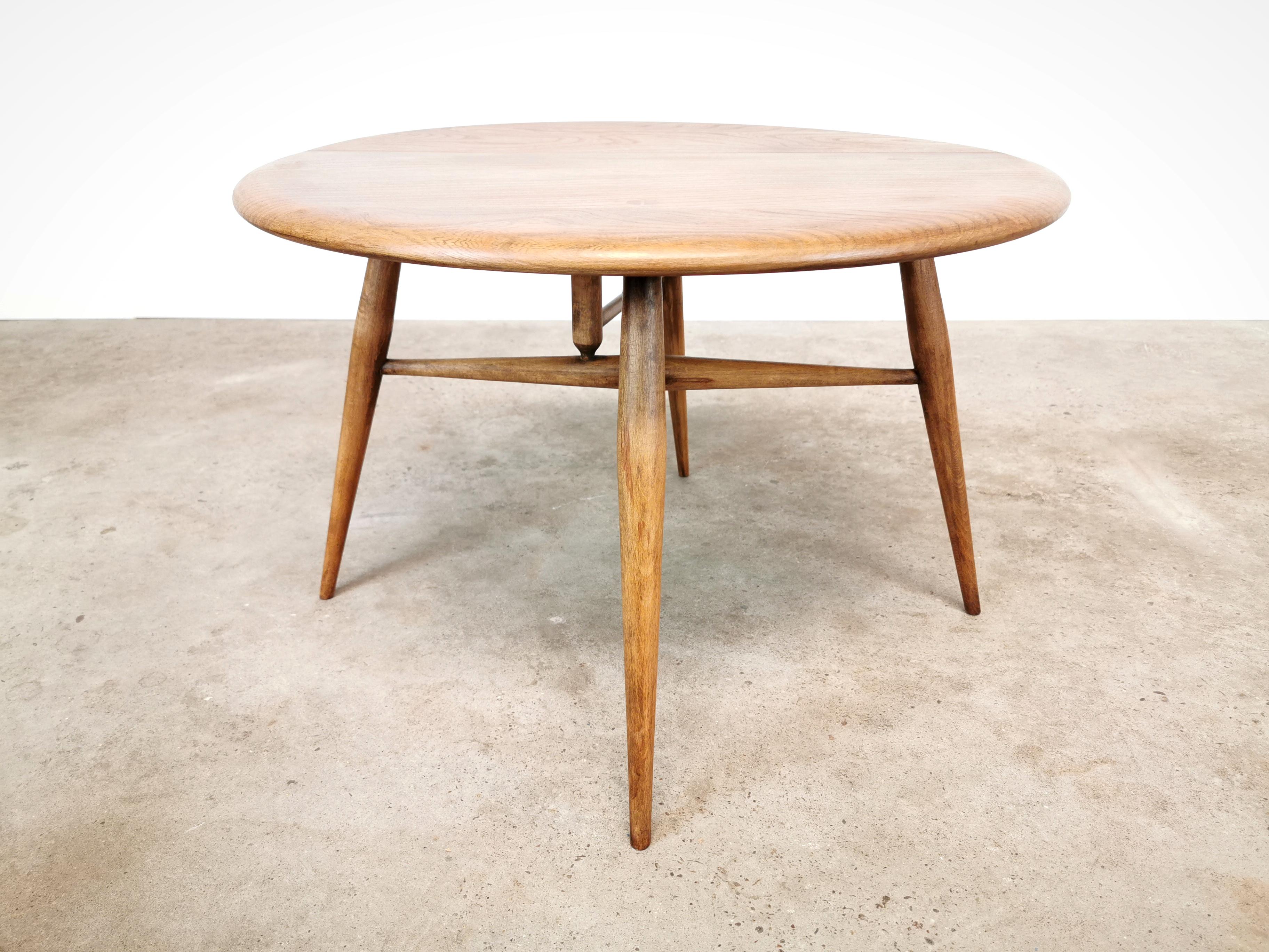 Midcentury 308 Ercol half moon coffee table with drop leaf.

Striking elm wood grain.

Dimensions when opened out: 40 cm H X 61 cm D X 61 cm W. 
Dimensions when leaf dropped: 40 cm H x 37 cm D x 61 cm W.