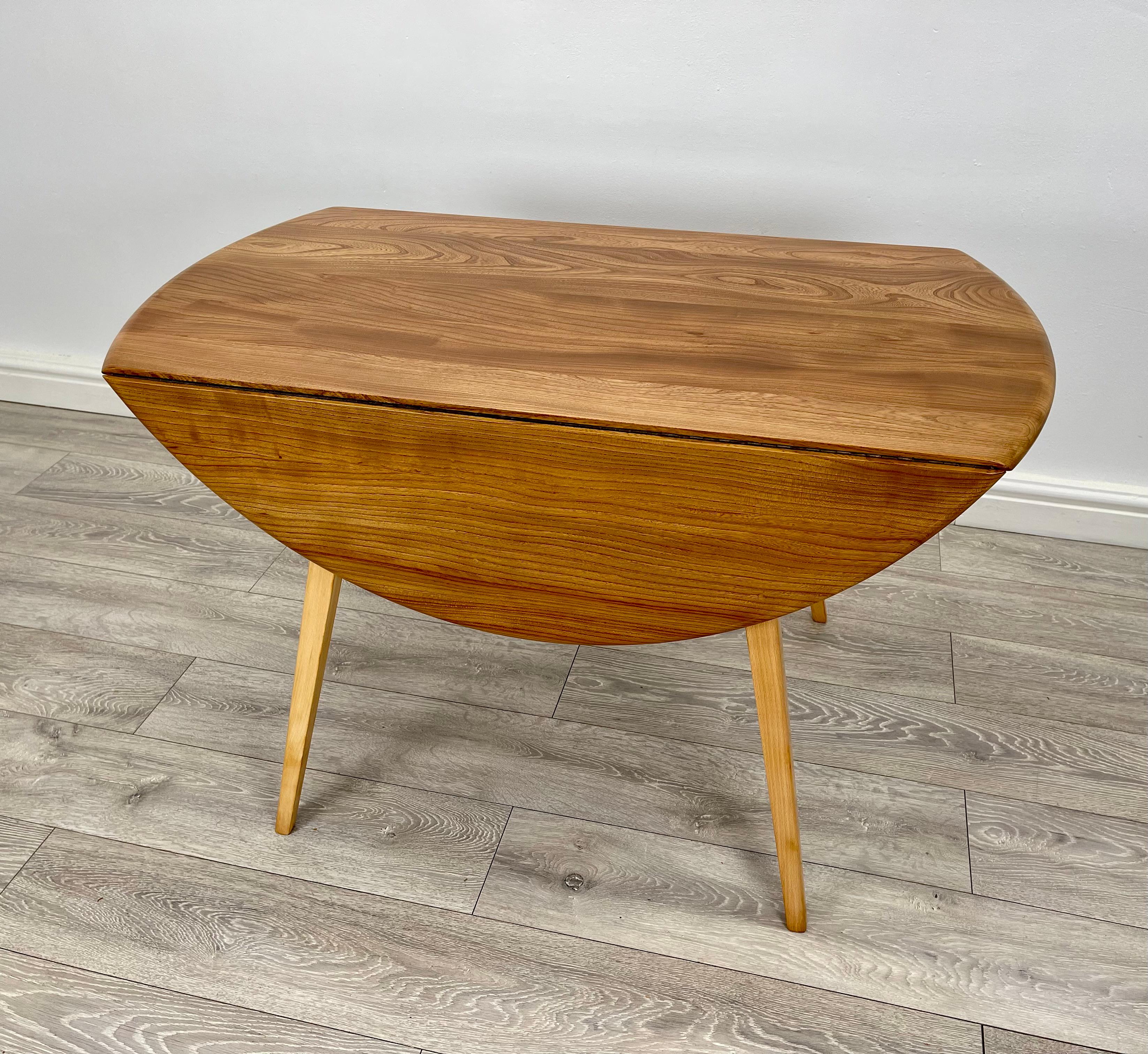 Beech Ercol blonde drop leaf dining table  For Sale