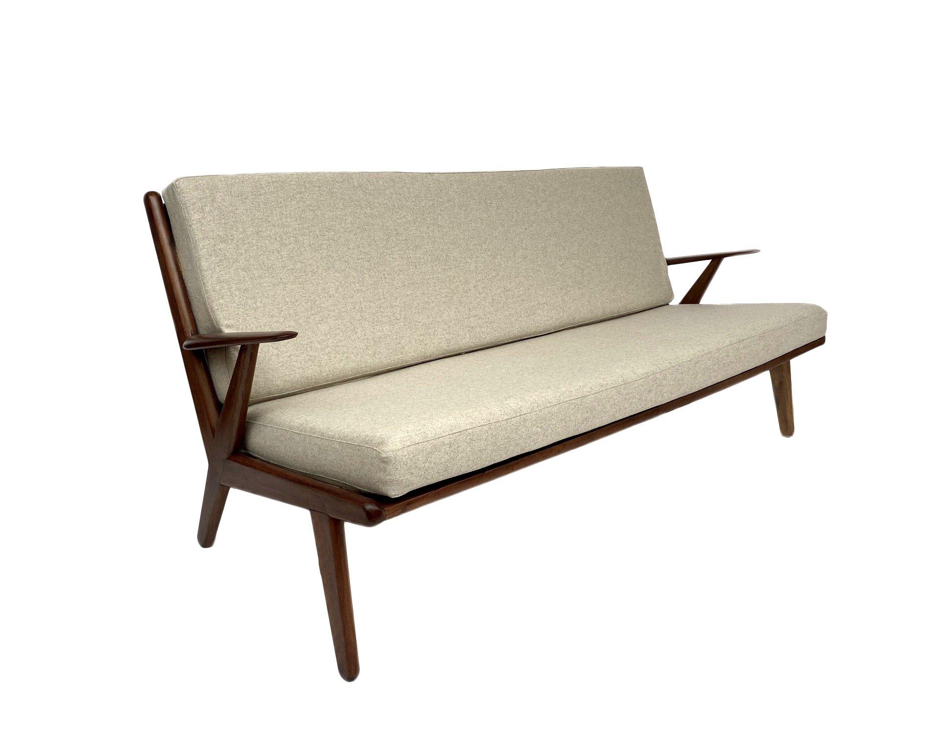 A beautiful Ercol cream wool and teak 3 seater sofa, this would make a stylish addition to any living or work area.

The sofa has a padded backrest and teak armrests for enhanced comfort. A striking piece of classic Scandinavian furniture.

The sofa