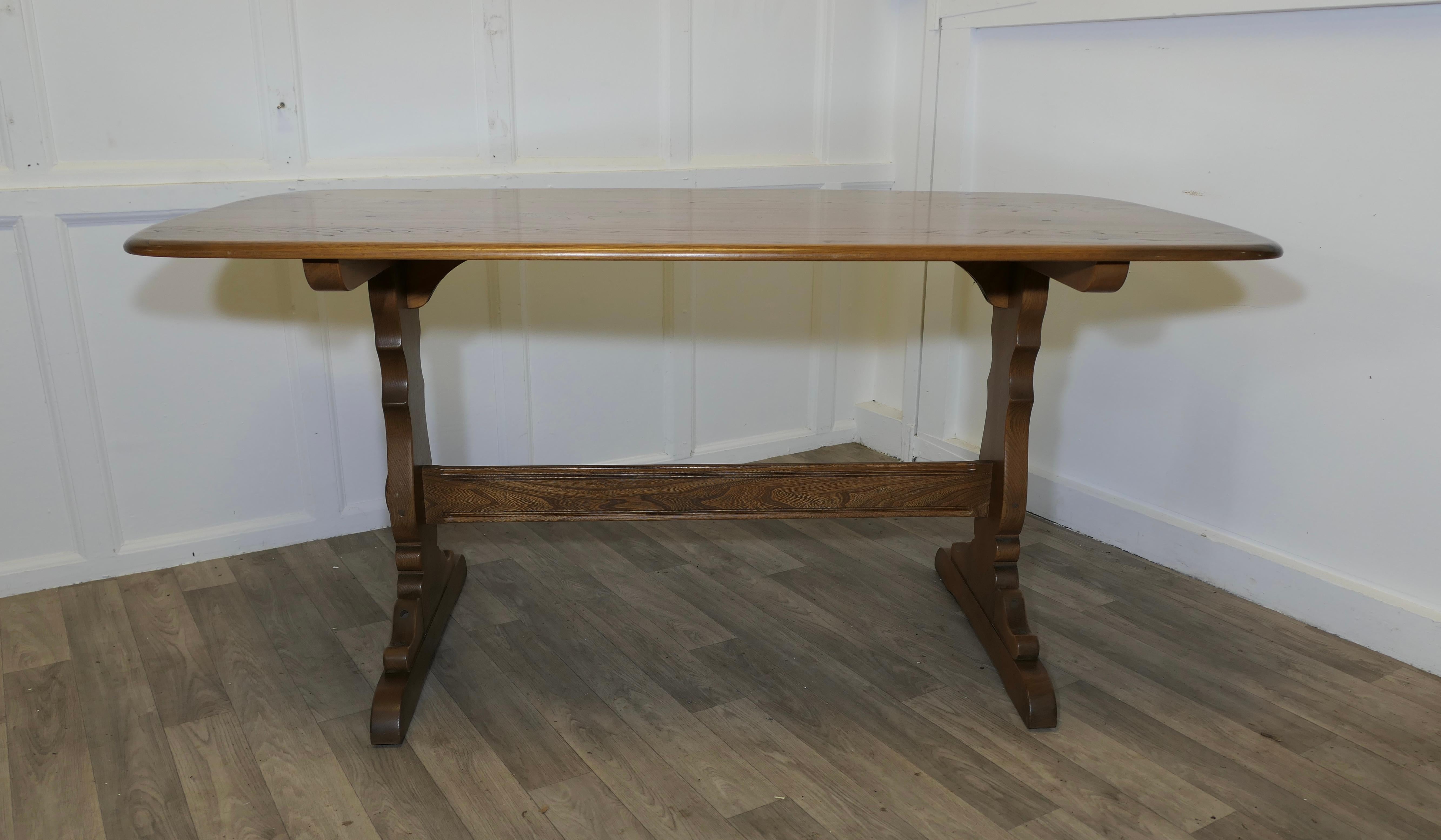 Ercol Golden Elm Refectory Dining Table

This is a Superb piece it is a good quality Country Elm Table in the refectory style, the table top has a curved edge with a slight boat shape to the top. The legs are in the refectory style with a cross