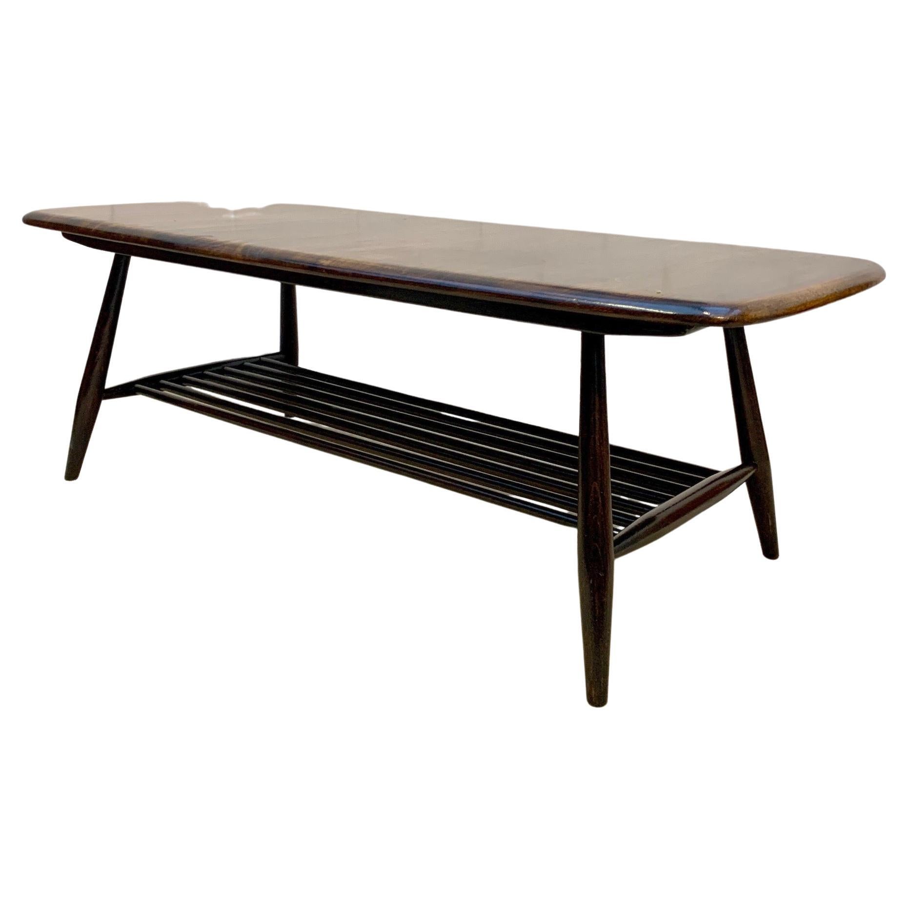 Ercol Model 459, midcentury coffee table with magazine rack

An iconic piece of British midcentury design, ready to add instant style and kudos to any modern interior.

The table measures 105cm L x 47cm D x 37cm H.