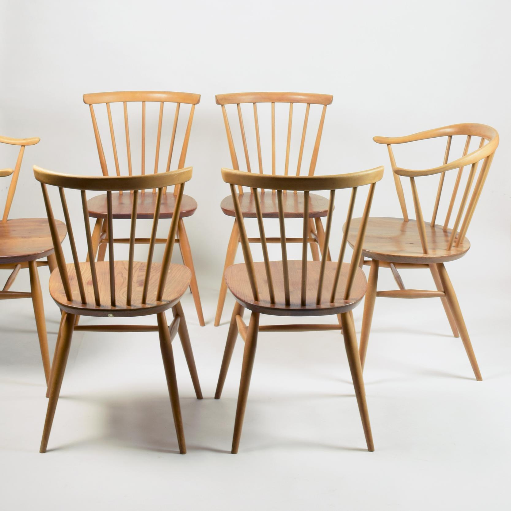 Lucian Ercolani for Ercol Furniture Ltd
'Windsor' Bow Top dining chairs, designed 1960s, these examples dating from circa 1970s.

Set of six, comprising:
Four model 449 side chairs
Two model 449A 'Cowhorn' armchairs

Solid elm and