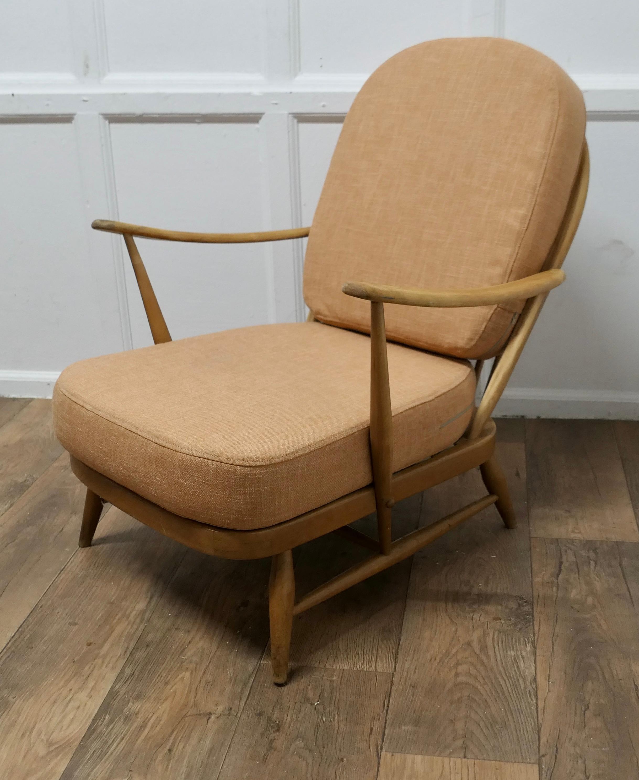 Ercol Windsor Easy Chair 

The chair is a classic design and traditionally made from beech in the classic Windsor style with a back wedge
The chair has sloping arms and back set with spindles, all the joints are all good, there is no woodworm or