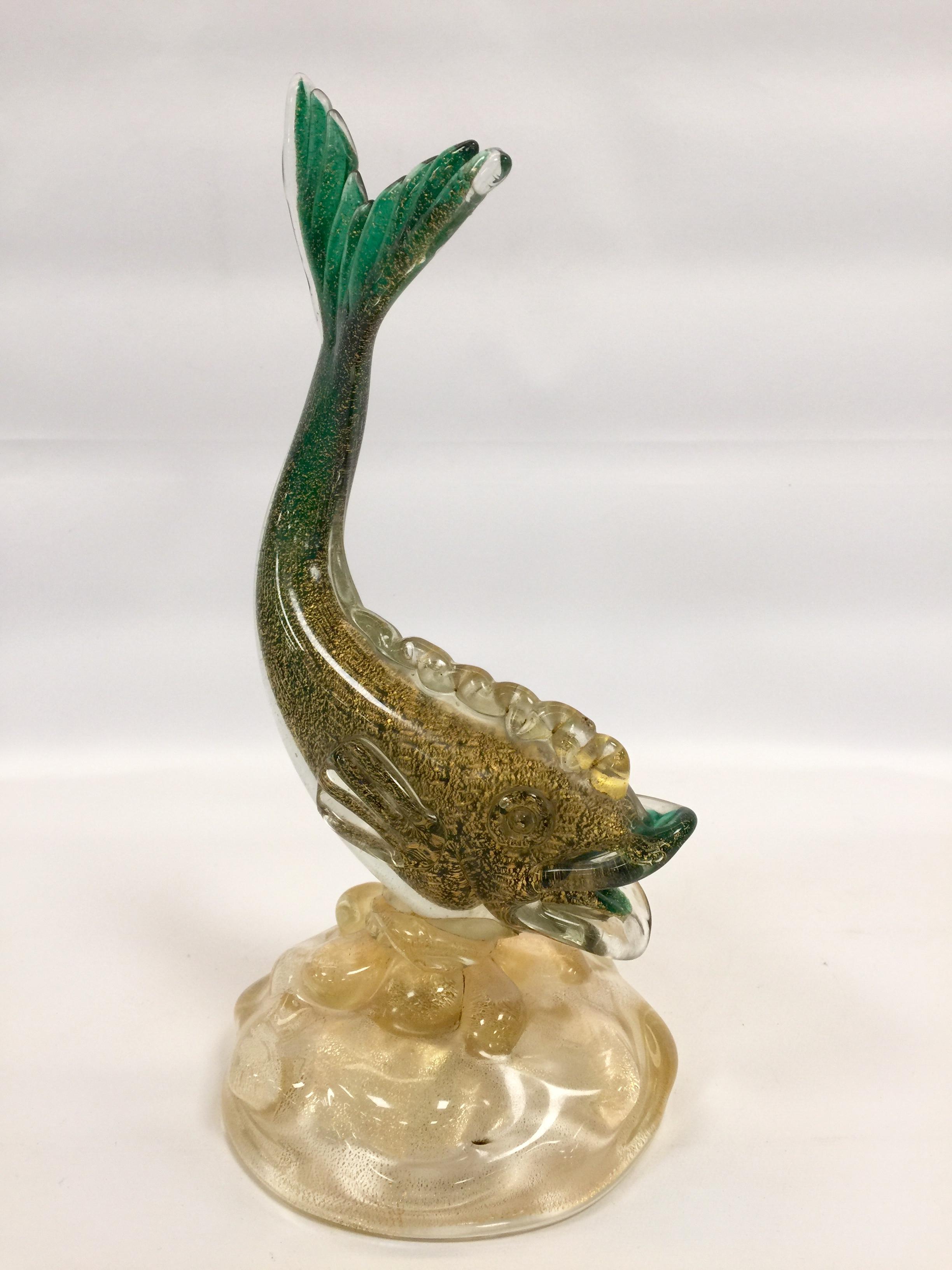 Vintage Ercole Barovier fish in artistic blown glass of Murano green sculpture with applications of air bubbles and gold foil.