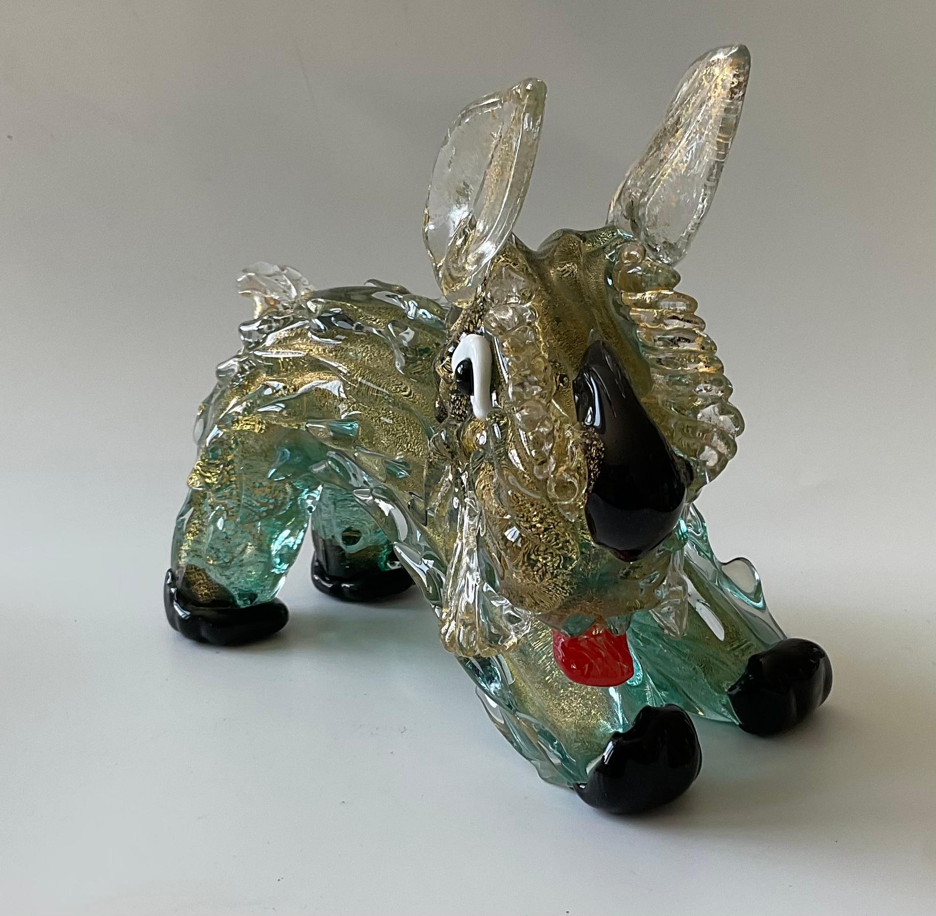 Ercole Barovier for Barovier and Toso Rare Murano glass sculpture of a dog In vibrant green glass with gold dust. Amazing detail and movement. 

The nearly fifty year tenure of Ercole Barovier as artistic director, designer and owner of Barovier &