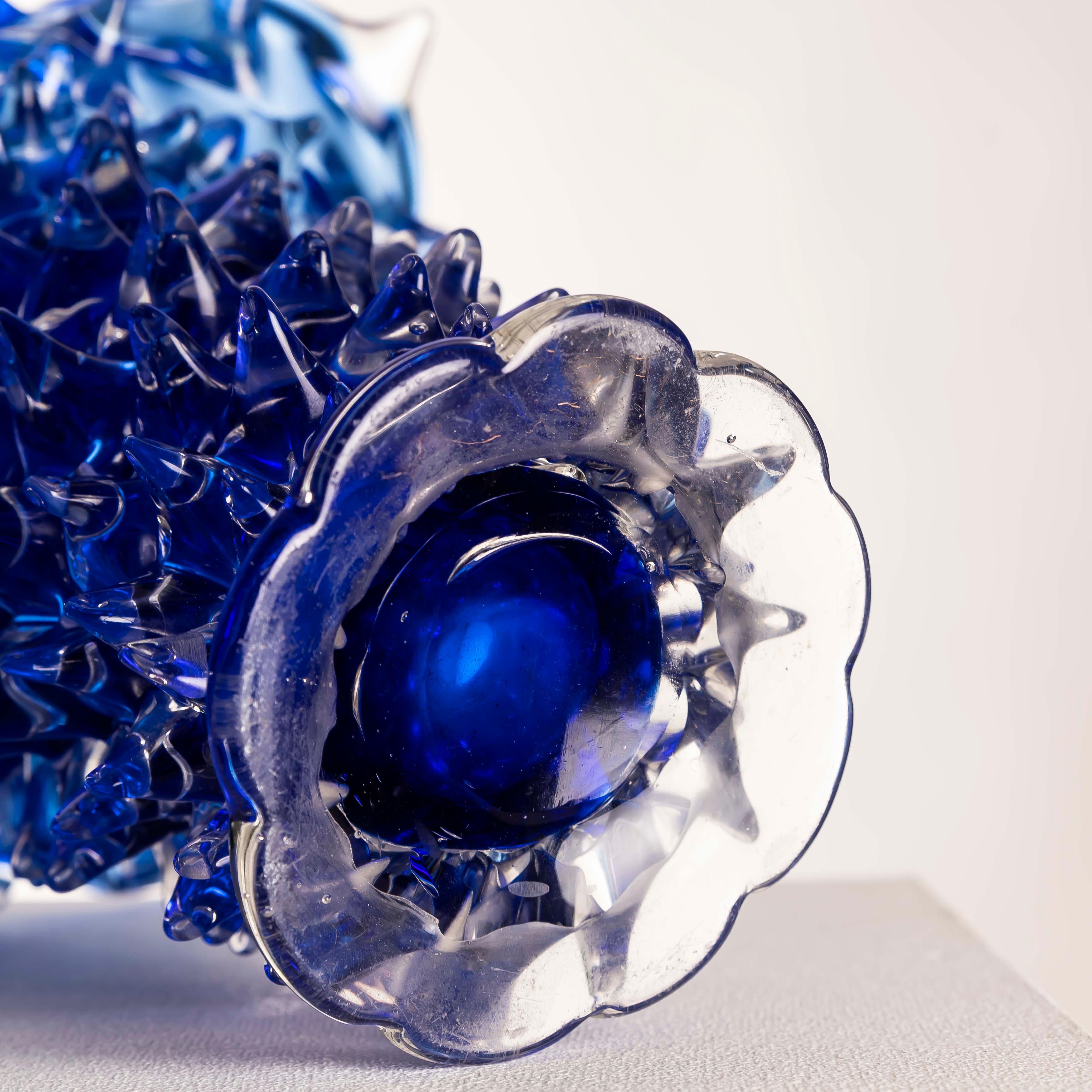This rare Murano “Rostrato” vase, designed by Ercole Barovier for Barovier & Toso circa 1960, exemplifies one of the most iconic glassmaking techniques of the 20th century. Crafted in a striking cobalt blue, the vase is entirely hand-blown and