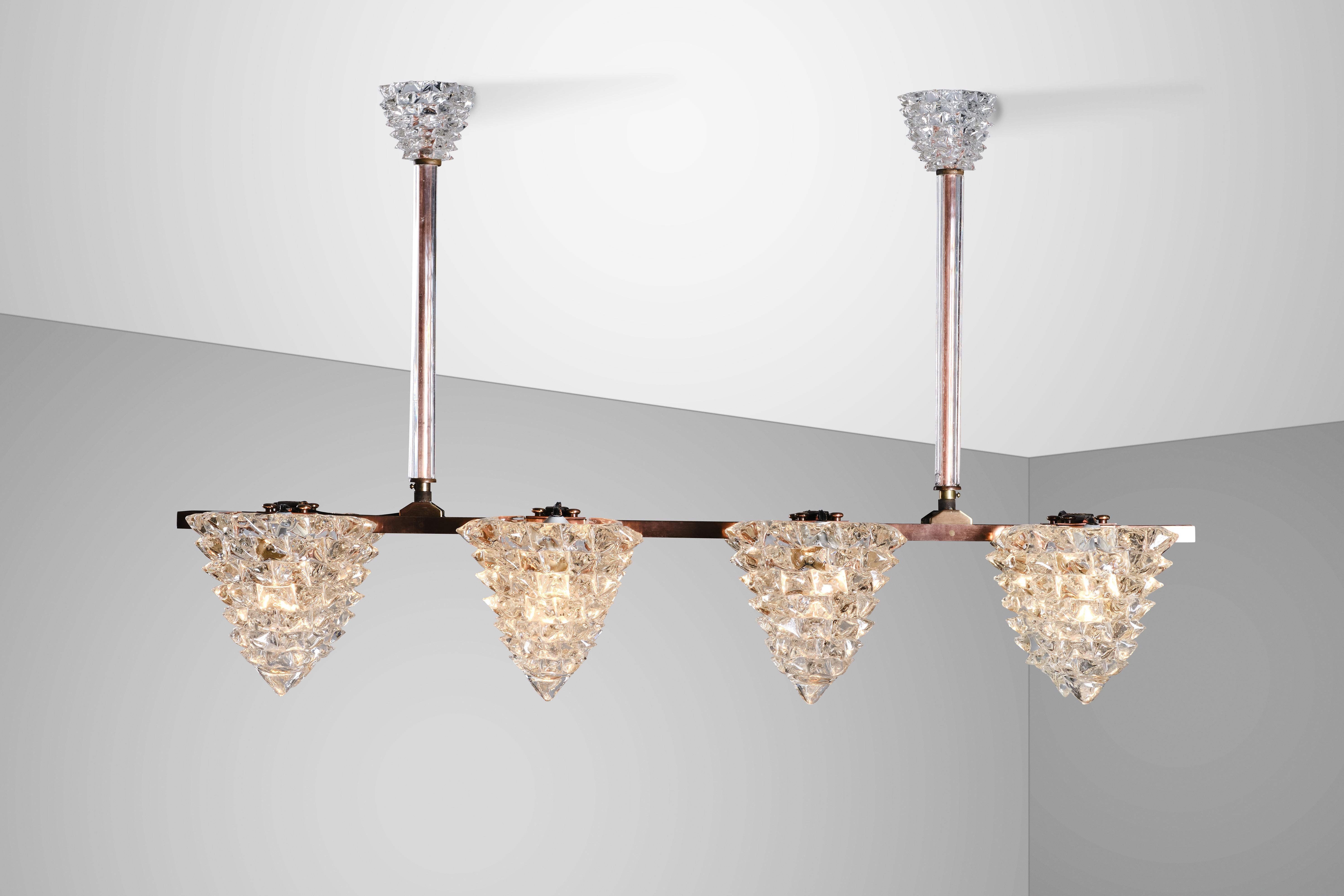 Manufactured in the 40s by Barovier&Toso, this ceiling lamp features 8 lights and a metallic structure wrapped in stunning blown Murano glass, while the light diffusers and the coverwires are in rostrated Murano gless
This is a truly unique piece