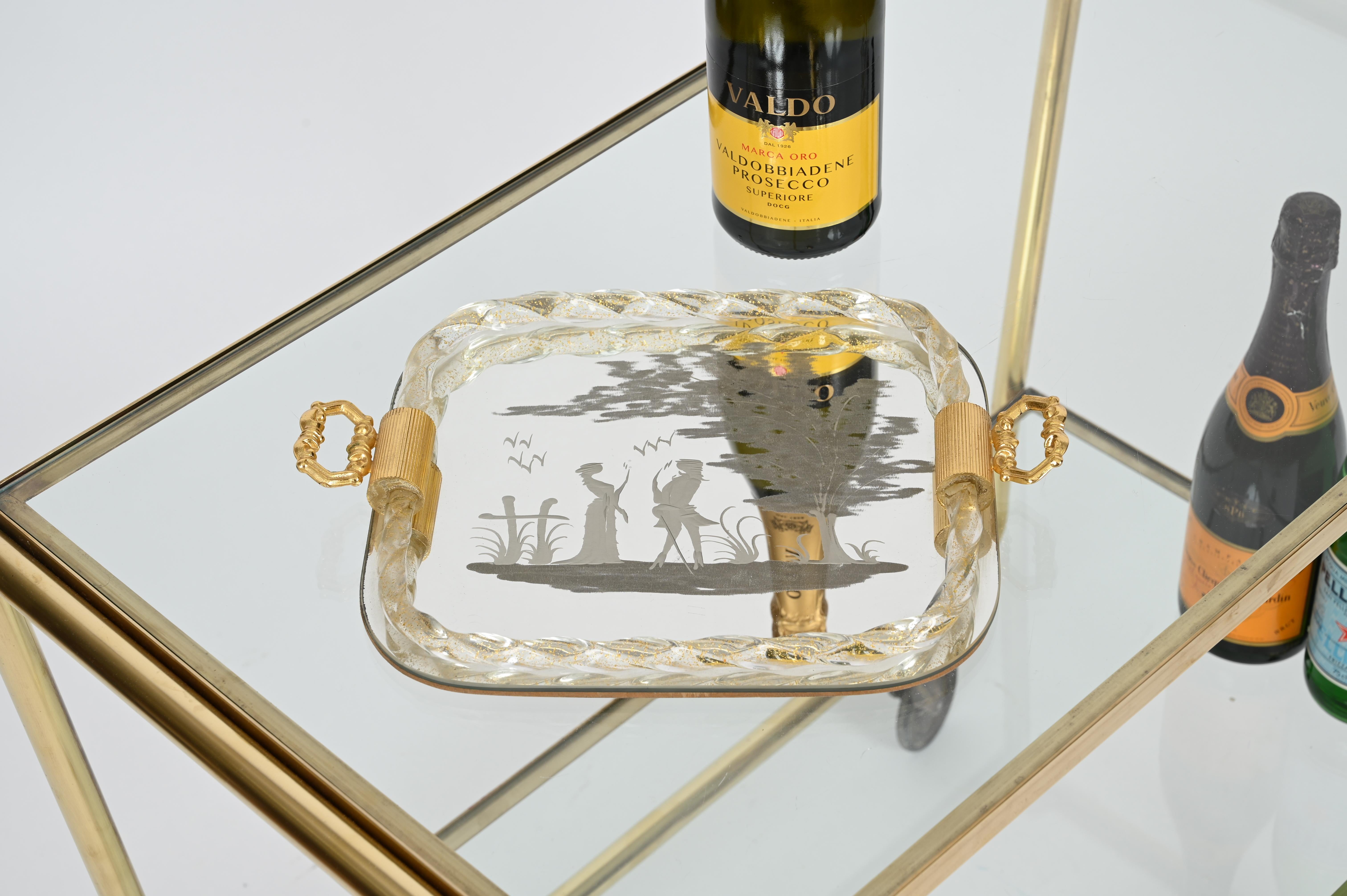 Splendid tiny rectangular shaped serving tray in a stunning combination of mouth-blown Murano glass with gold specks inside, acid-etched mirror and gilt metal handles. This gorgeous piece was produced in Italy during the 1940s by the master Murano
