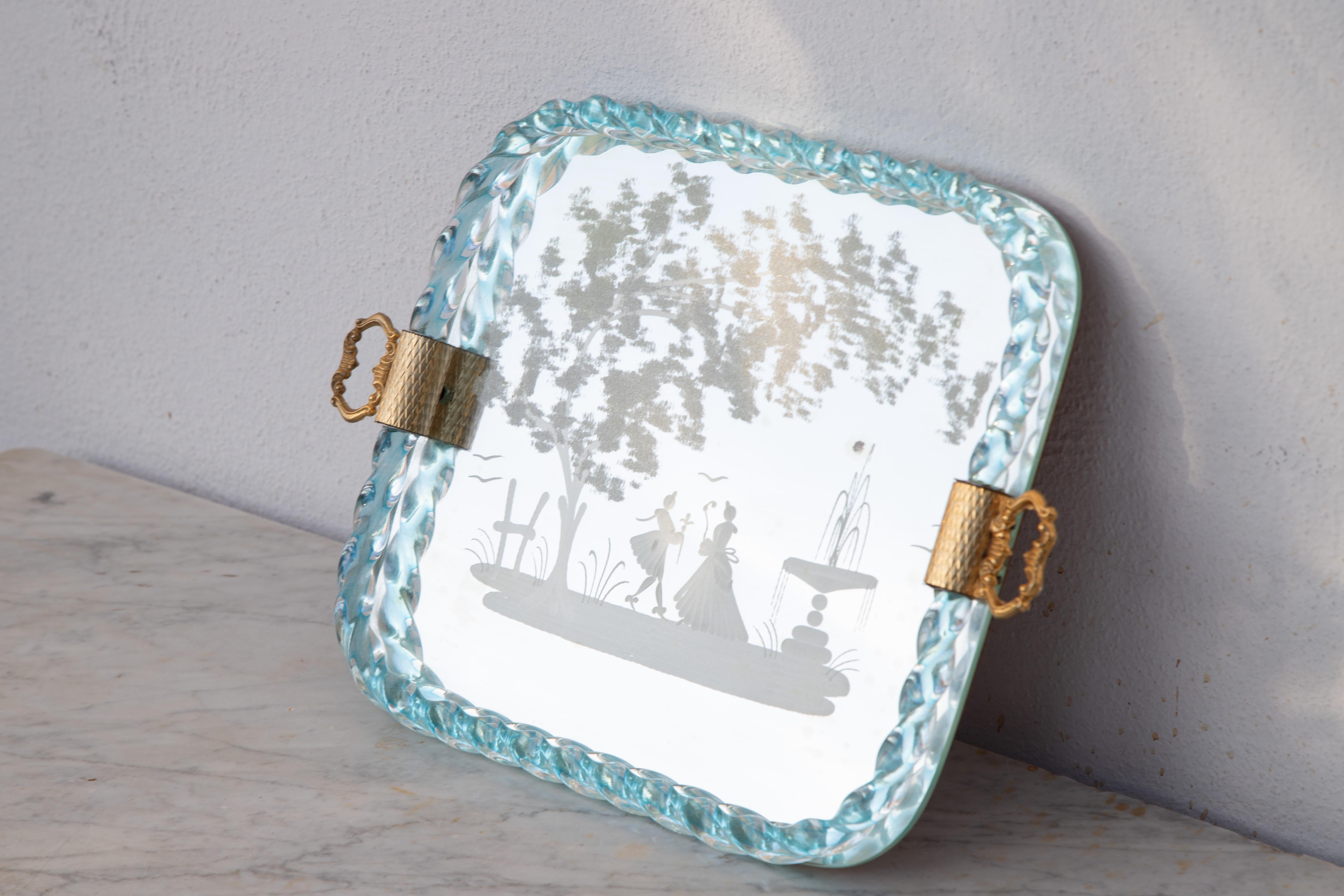 Rectangular Murano glass tray from the 1950s. Noble Venetian mirror glass with etched golden tendril decoration, a turned glass edge and gilded handles. Stylish Italian craftsmanship from Venice.

