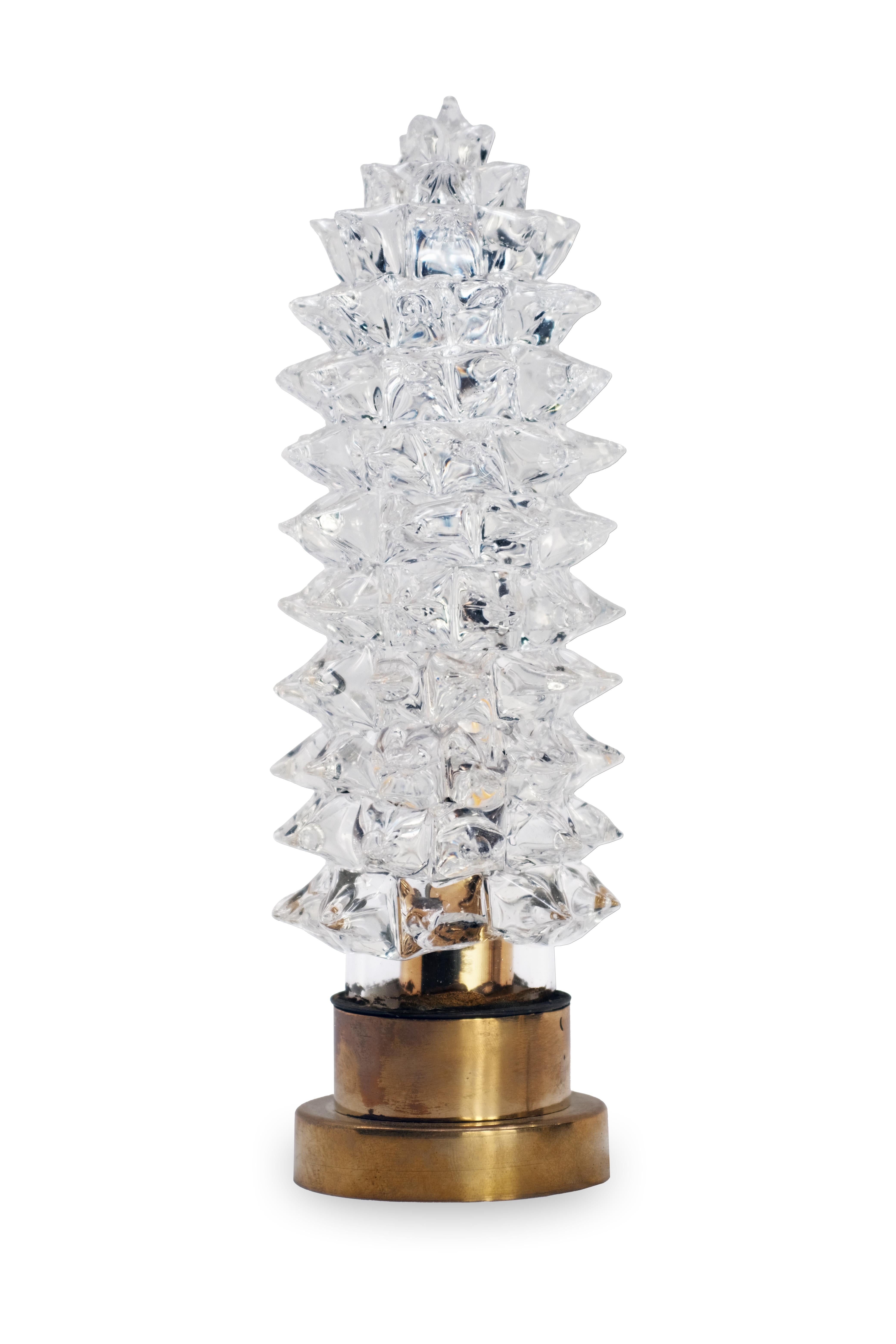 Elevate any interior with this exquisite set of four Italian Mid-Century Modern table lamps, crafted in the 1970s and defined by their sophisticated play of light, texture, and form. Each lamp features a meticulously hand-blown rostrato glass