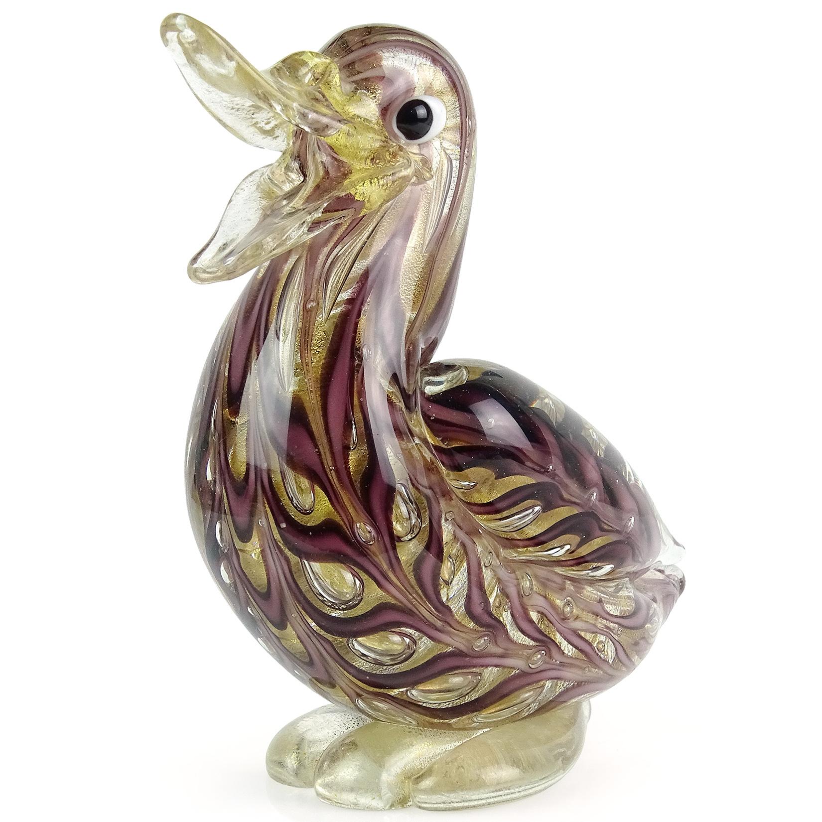 Beautiful and rare, vintage Murano hand blown purple and gold flecks Italian art glass bird duck sculpture. Documented to designer Ercole Barovier for Barovier e Toso. The figure still retains the original Barovier label underneath, marked item
