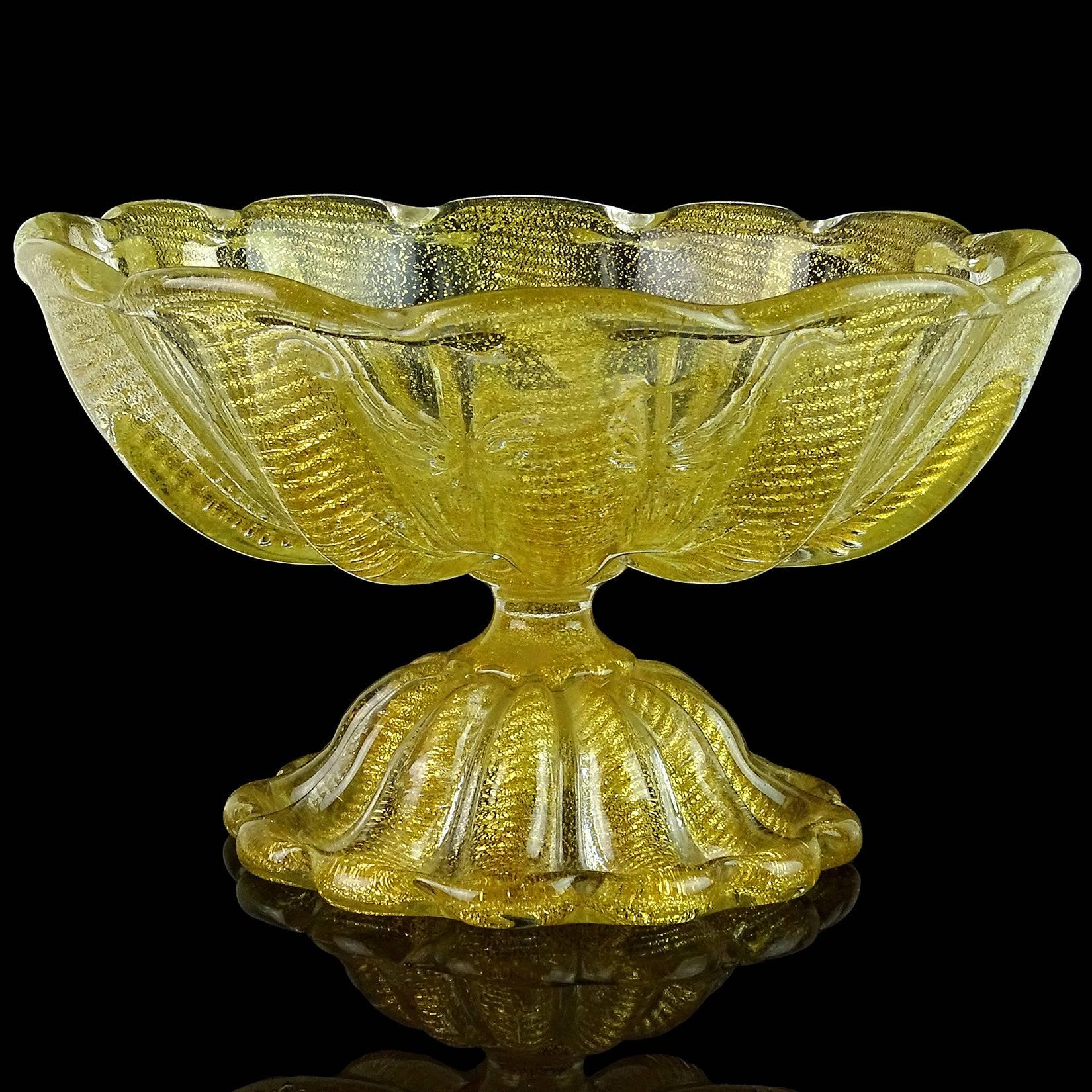 Beautiful vintage Murano hand blown gold flecks Italian art glass footed compote bowl or centerpiece. Documented to designer Ercole Barovier for Barovier e Toso. The piece has a ribbed design with ropes of gold, 