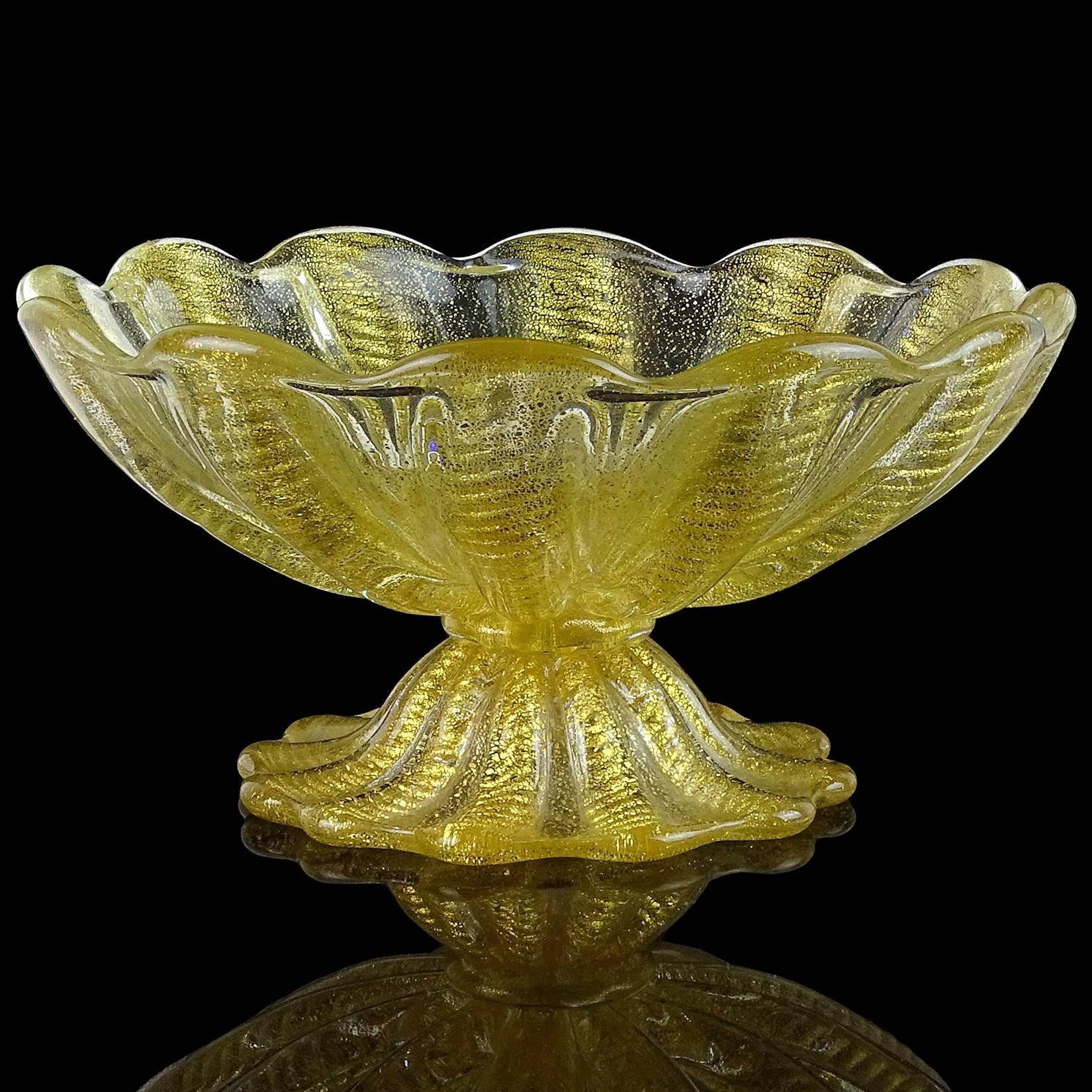 Beautiful vintage Murano hand blown gold flecks Italian art glass compote footed bowl. Documented to designer Ercole Barovier for Barovier e Toso. The piece has a ribbed design with ropes of gold, 