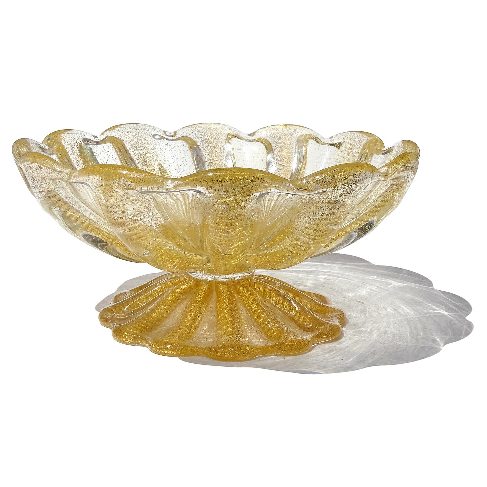 Beautiful vintage Murano hand blown gold flecks Italian art glass footed compote bowl. Documented to designer Ercole Barovier for Barovier e Toso. The piece has a ribbed design with ropes of gold, 