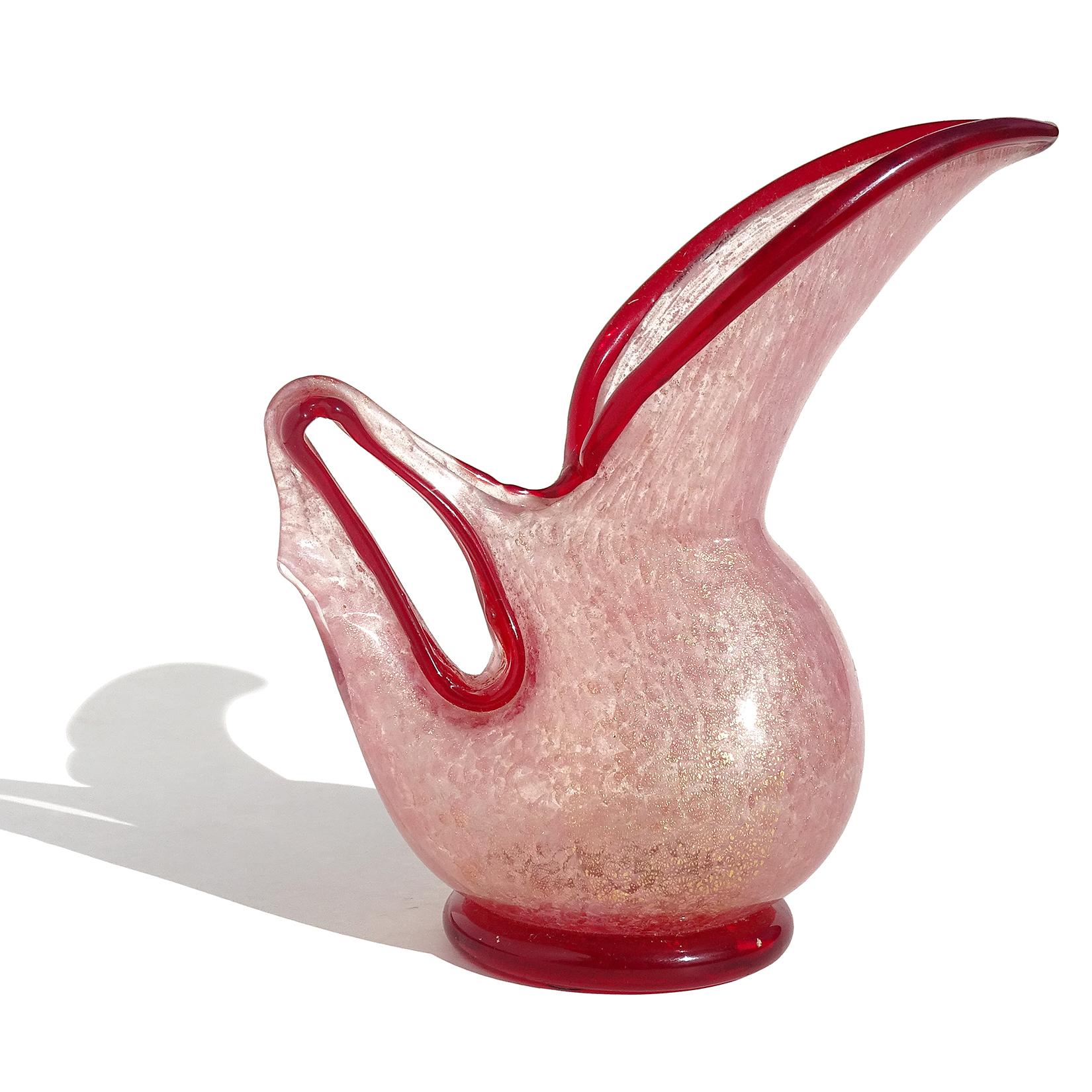 Beautiful, and rare shape, vintage Murano hand blown red trim and pink pigments Italian art glass pitcher or vase with gold flecks. Documented to designer Ercole Barovier, for the Barovier e Toso company. Part of the 