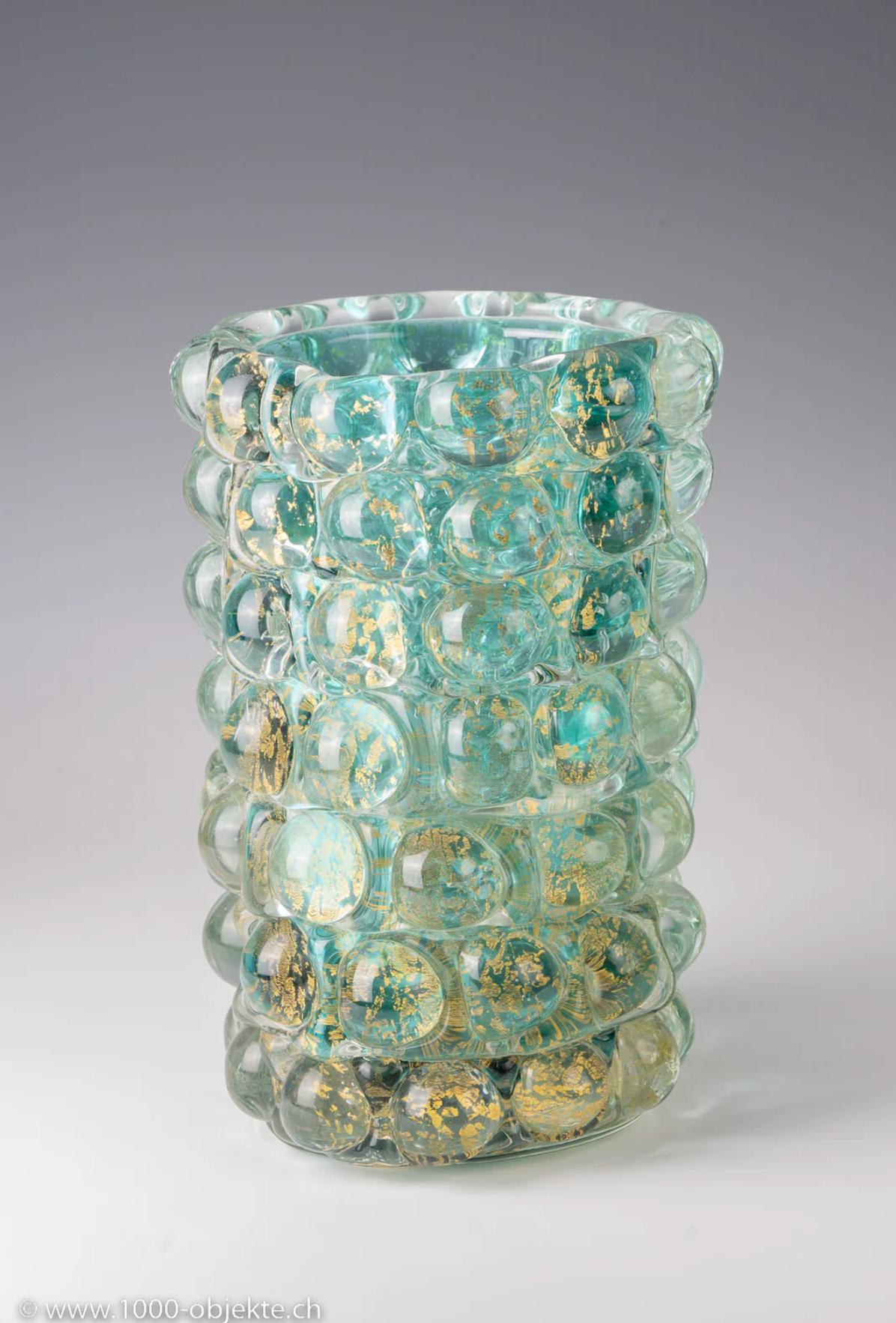 Ercole Barovier, vase model 'Lenti', ca. 1940
 

Ercole Barovier (1889-1974), vase model 'Lenti', ca. 1940
clear and turquoise glass with gold inclusions
produced by Barovier & Toso, Murano, Italy
31 cm (height)
not signed

very good