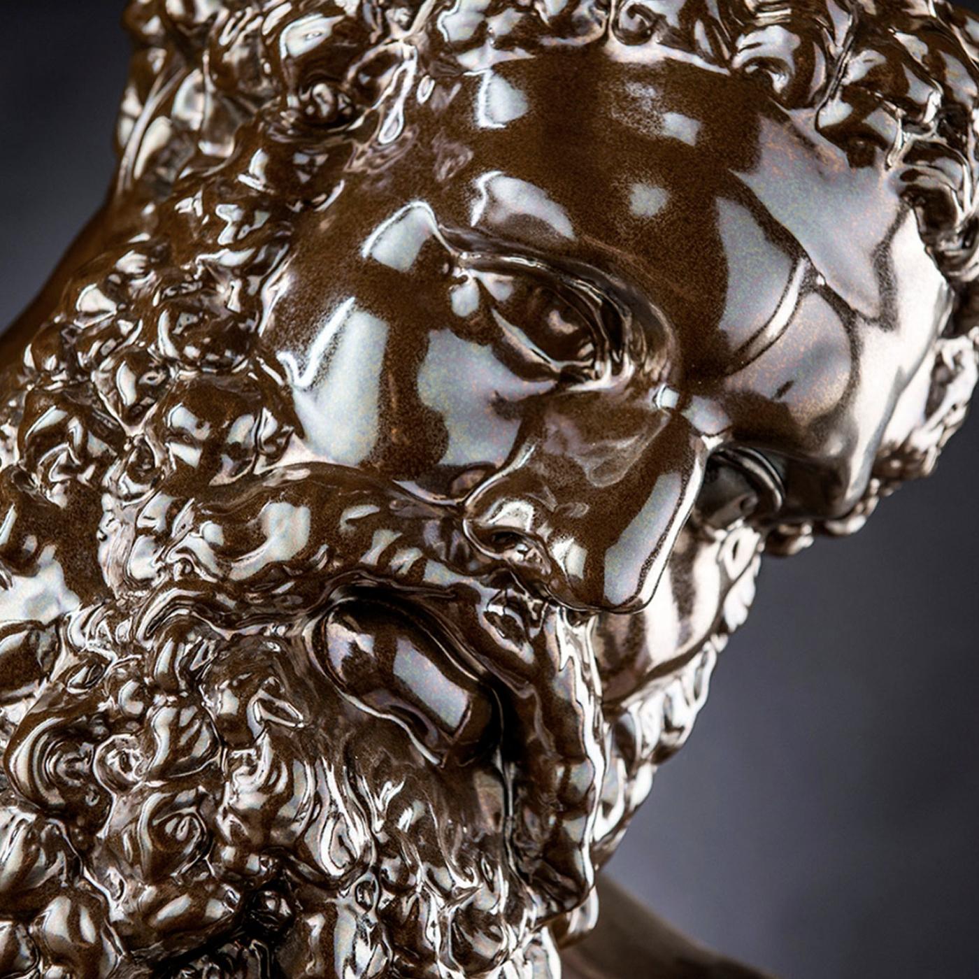 Entirely handcrafted of ceramic with an elegant glossy brown glaze, this decorative sculpture depicts the mythological hero Hercules, here reinterpreted with a modern twist. Unique and generously sized, this piece will make a statement whether used