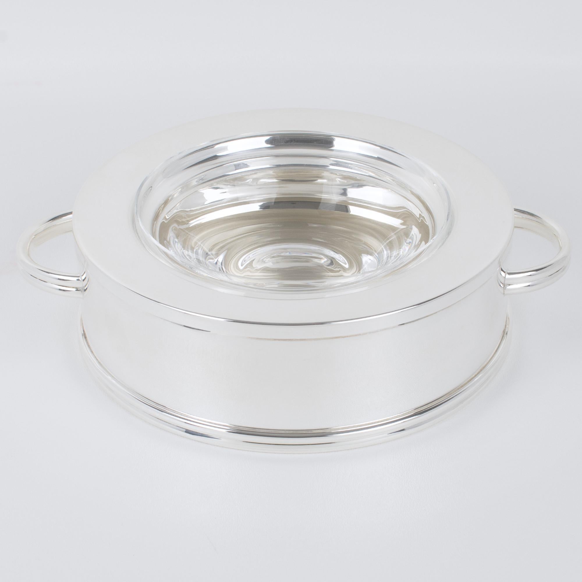 French silversmith Ercuis designed this spectacular modernist silver plate and crystal caviar serving bowl, dish, or chiller. The serving piece was expertly crafted in France circa 1960. The outstanding design features a streamlined geometric shape,