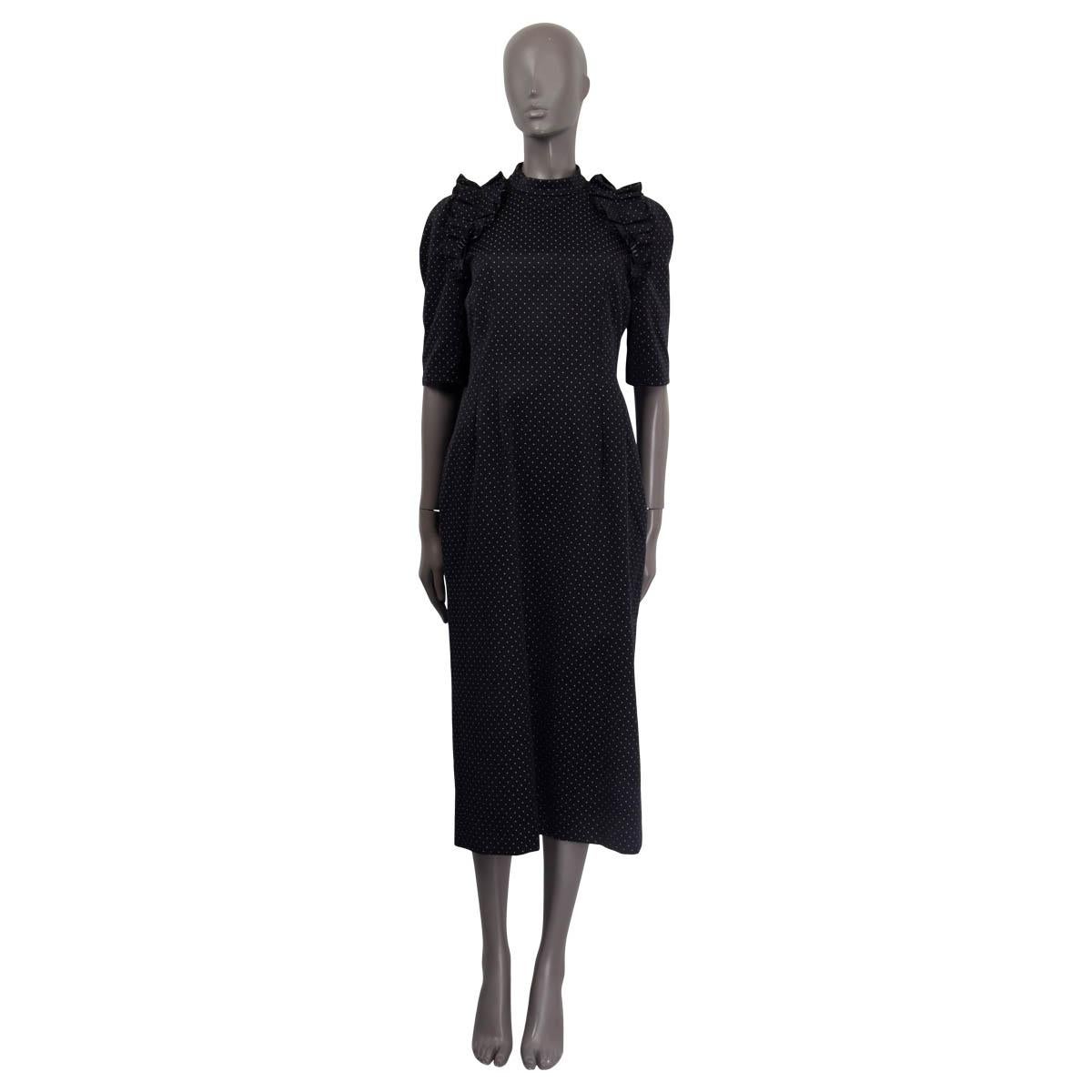 100% authentic Erdem 'Margaretta' midi dress in black and white cotton (63%) and polyester (37%). Features ruffled details on the shoulders and short sleeves. Has a slit on the back. Opens with a concealed zipper and two buttons on the back. Lined
