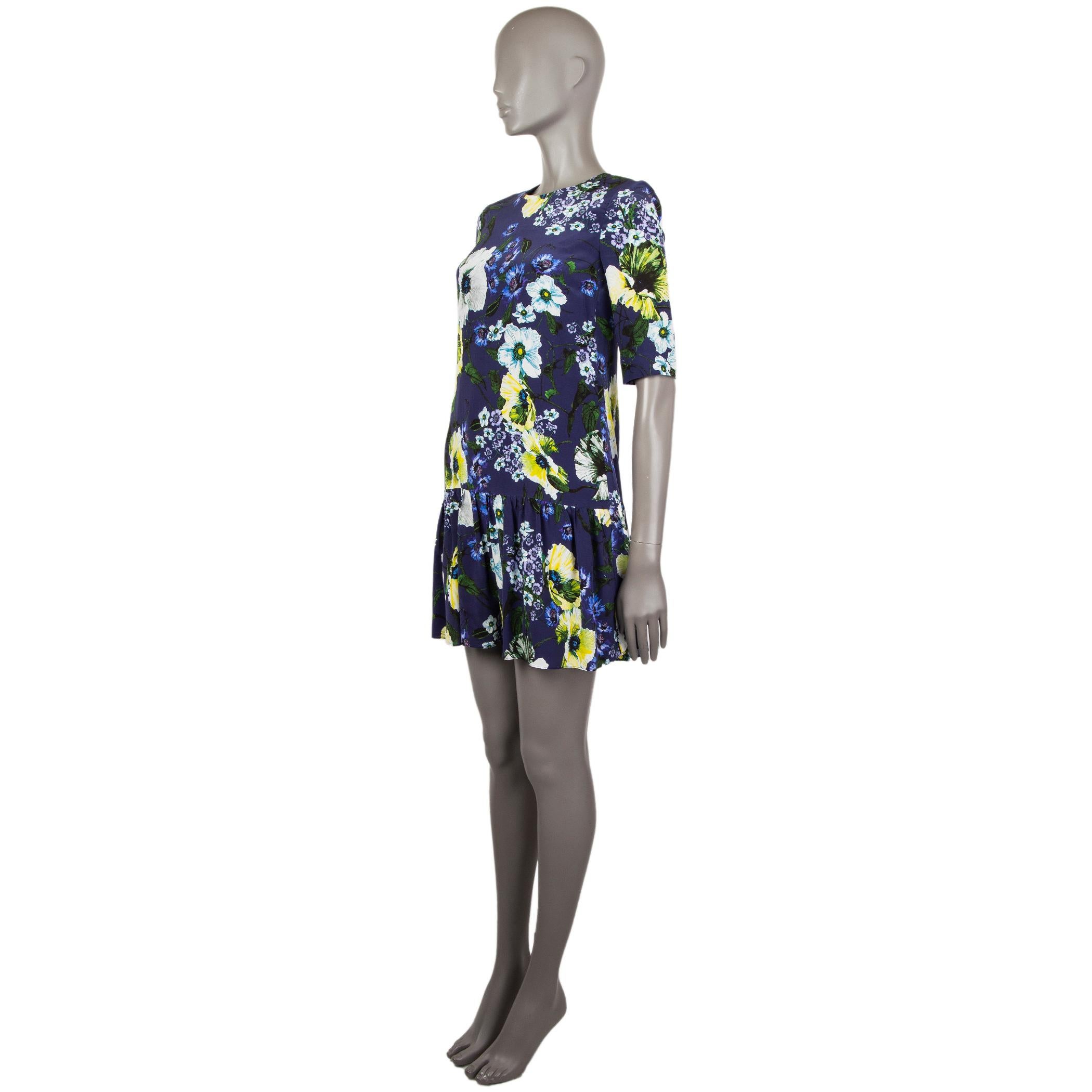 100% authentic Erdem 'Emmie' floral dress in indigo, green, white, yellow, and purple silk (100%). With crew neck, 3/4 sleeve, and gathered drop waist. Closes with hook and invisible zipper on the back. Lined in indigo silk (100%). Has been worn and
