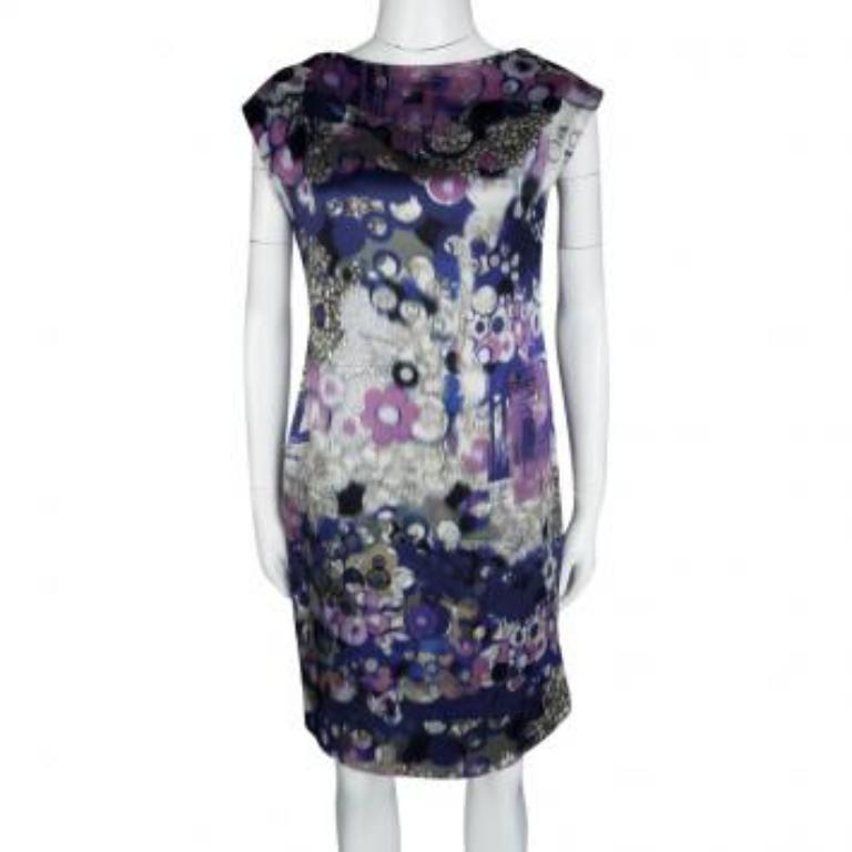 Erdem's silk dress is the perfect way to look chic and cool for summer parties. It is artfully designed with a multicolour printed body in a minimal silhouette and comes with a rounded neckline and short sleeves. Style with ankle booties or beaded