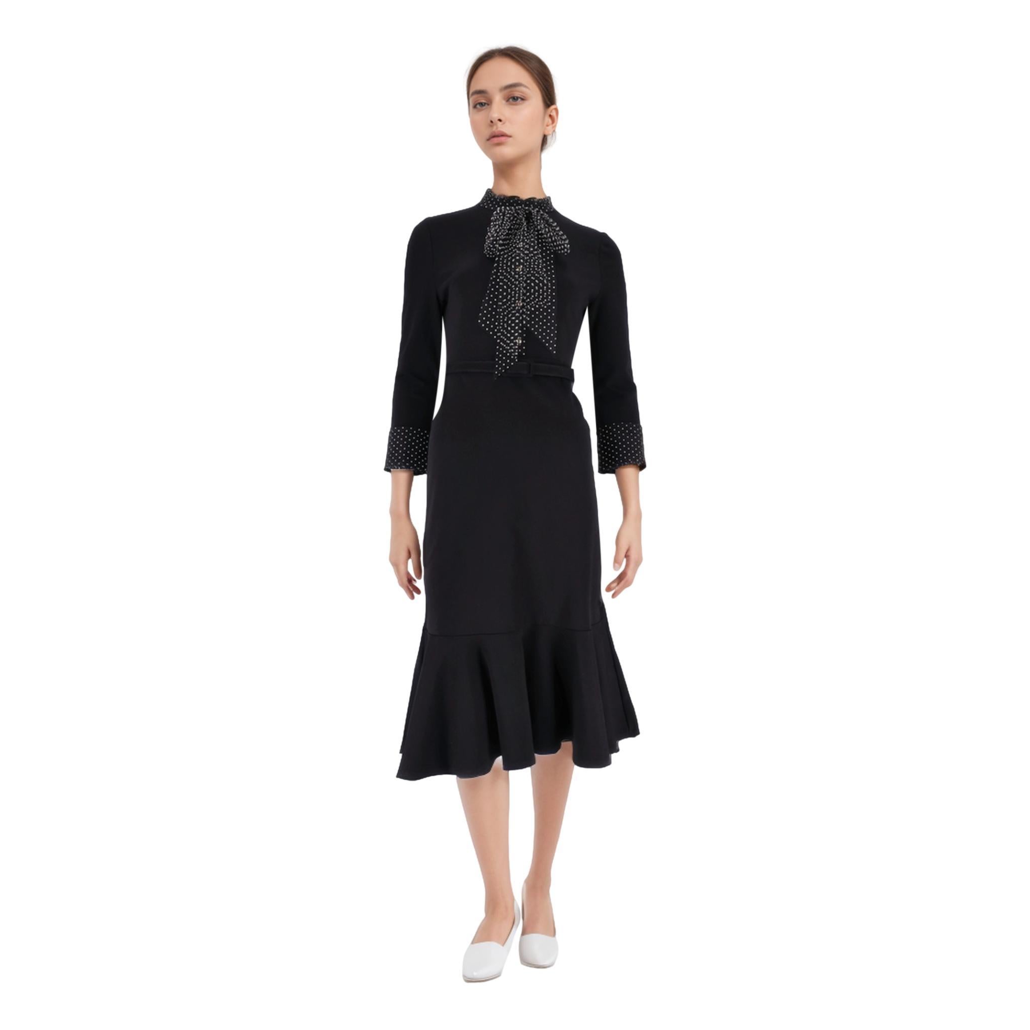 Brand New - Erdem Polka-Dot Tie Midi Dress

Black fitted 'Hilma' dress designed with contrasting polka-dot printed neck-tie, cuffs, and button placket.

Featuring standing collar, belted waist, and fluted hem. Zip closure to rear.
Size –