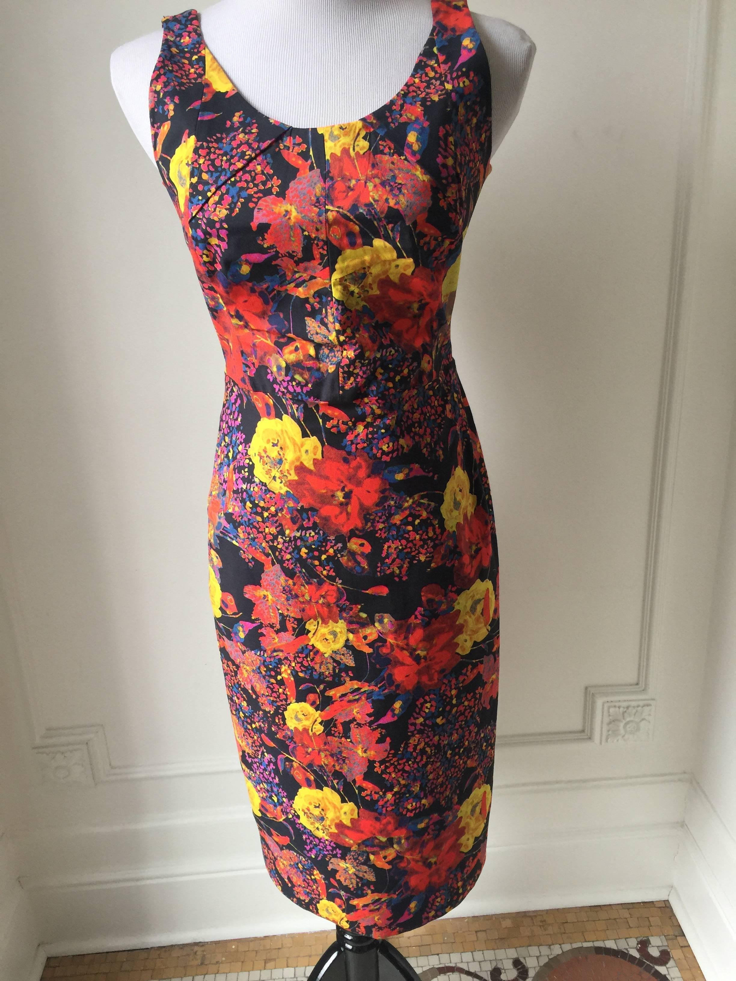 Fitted Floral Sexy Dress by Erdem.
Black ,red and multicolored sleeveless with scoop neckline, and hidden zipper in the back...
Wonderful little dress for this spring and summer.