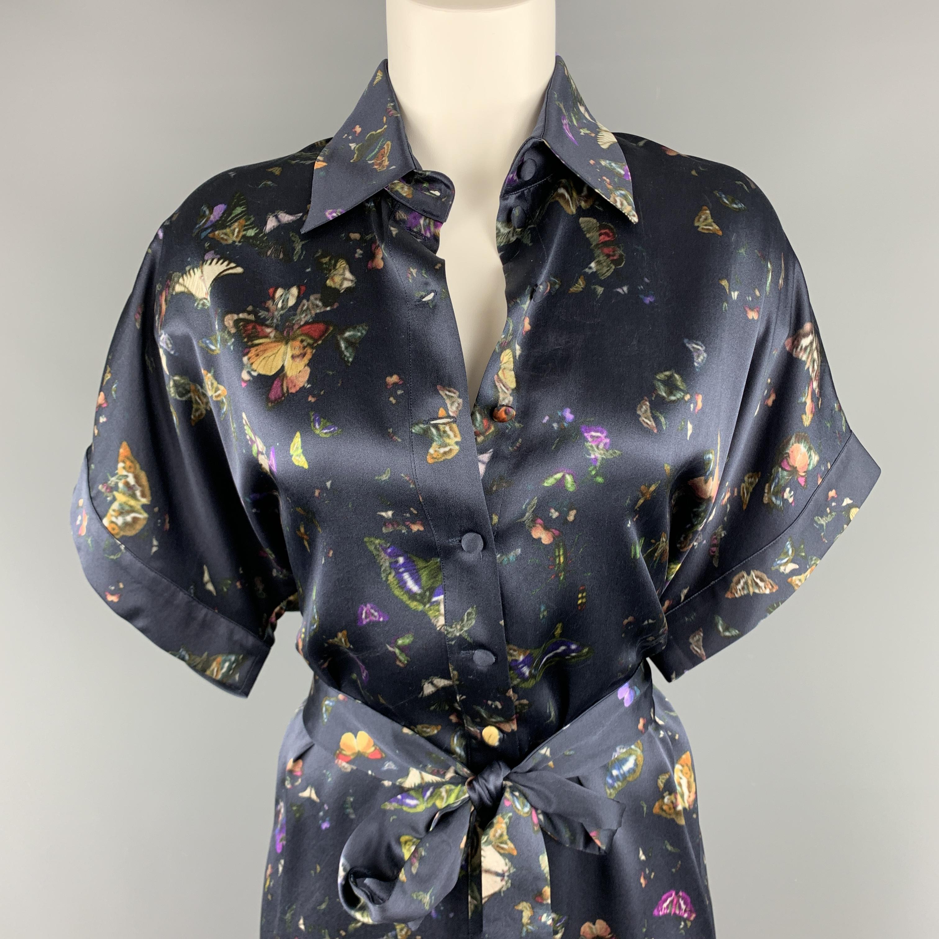 ERDEM shirt dress comes in navy blue silk satin with an all over butterflies print, pointed collar, drop shoulder short sleeves, button up front, and tied belt waist. Made in Italy.

Excellent Pre-Owned Condition.
Marked: 8

Measurements:

Bust: 44