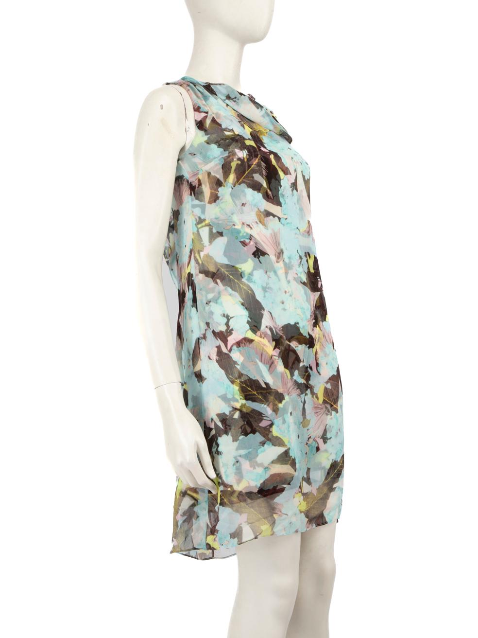 CONDITION is Good. Minor wear to the dress is evident. A small hole on the front left side. Pulls to the weave on both shoulders, the front drape, front waist, right side, under the right armpit and on the centre back above the hem. Loose thread