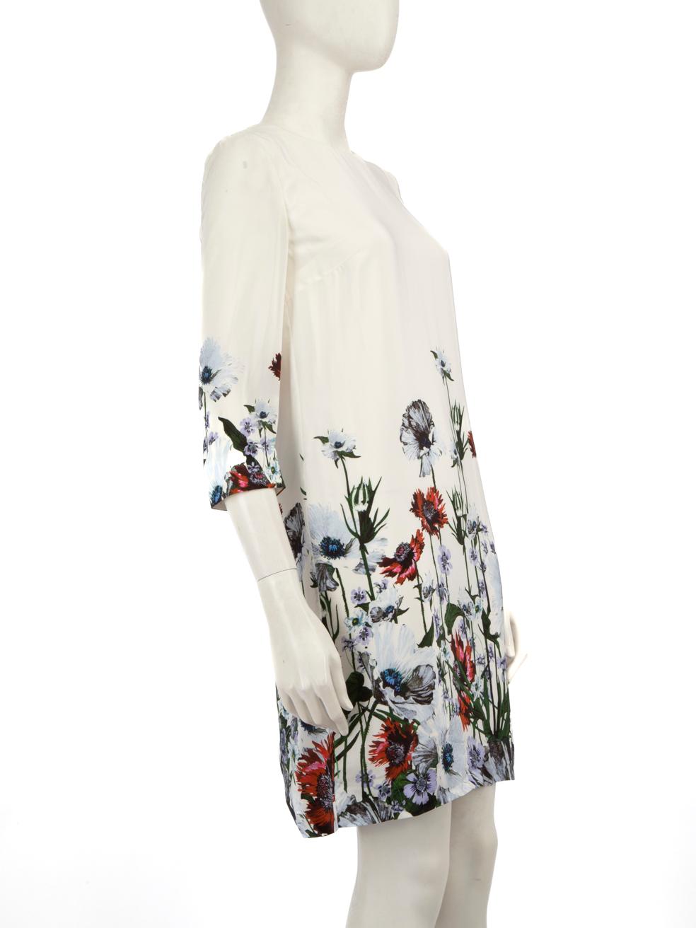 CONDITION is Very good. Minimal wear to the dress is evident. Pulls to the weave on both cuffs, the right sleeve and towards the front hem. Discolouration on the inner side of the neckline to the left and on the upper back. Missing size and
