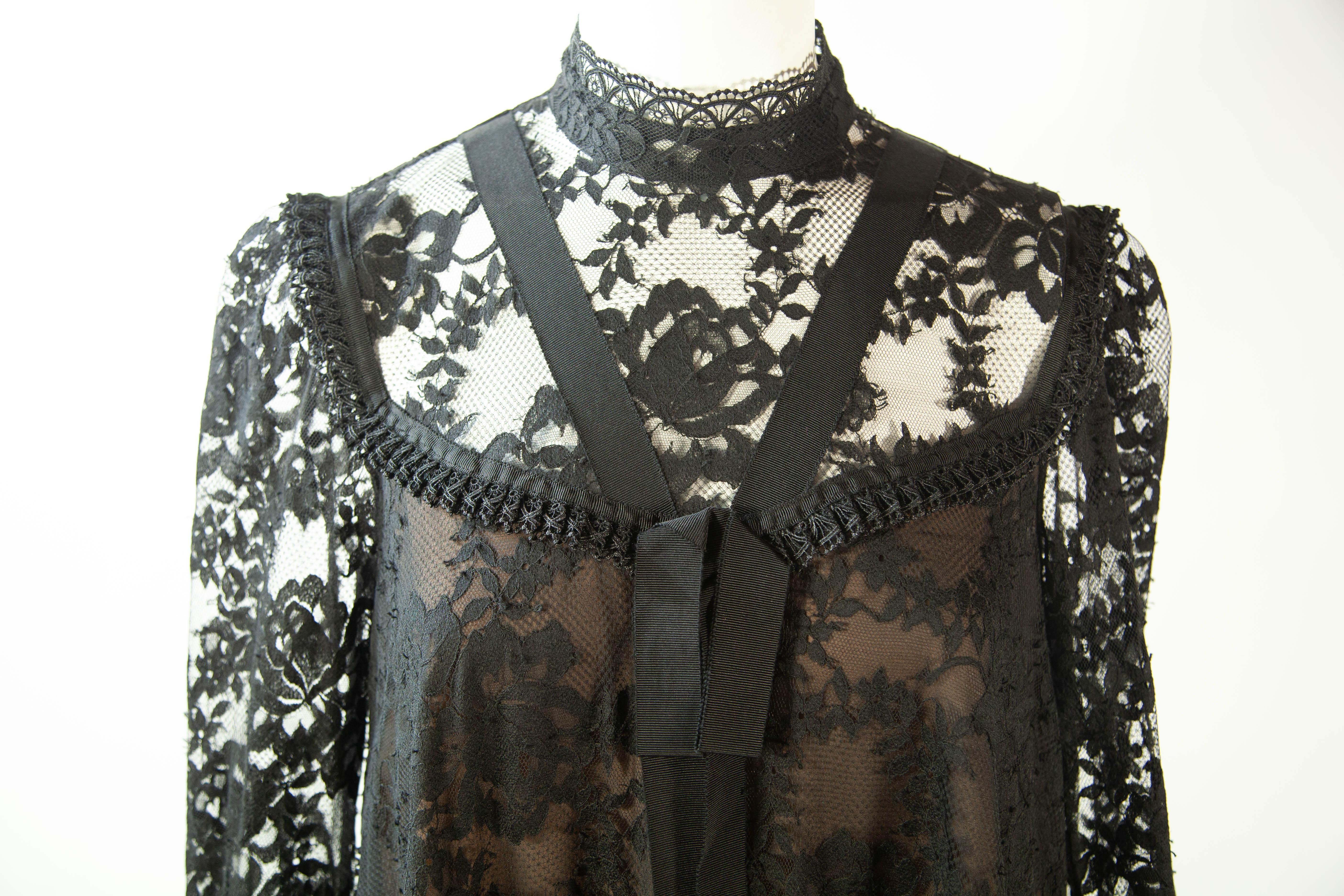 Erdem X H&M black, lace dress with pleated cuffs and hem. Worn by celebrity (please inquire).

34