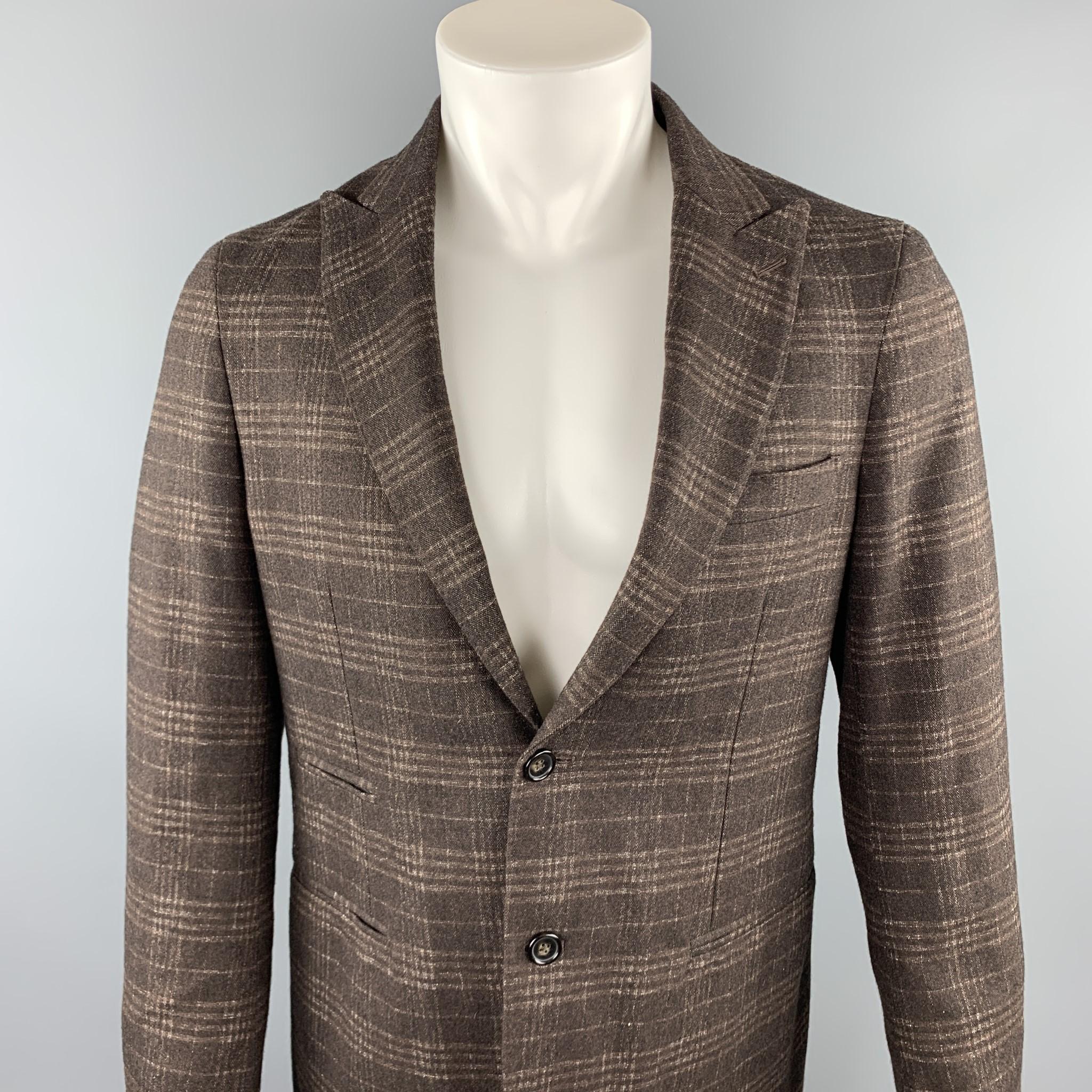 EREDI PISANO sport coat comes in a brown plaid wool blend featuring a peak lapel style, slit pockets, and a two button closure. Made in Italy.

Excellent Pre-Owned Condition.
Marked: IT 50

Measurements:

Shoulder: 16.5 in. 
Chest: 40 in. 
Sleeve: