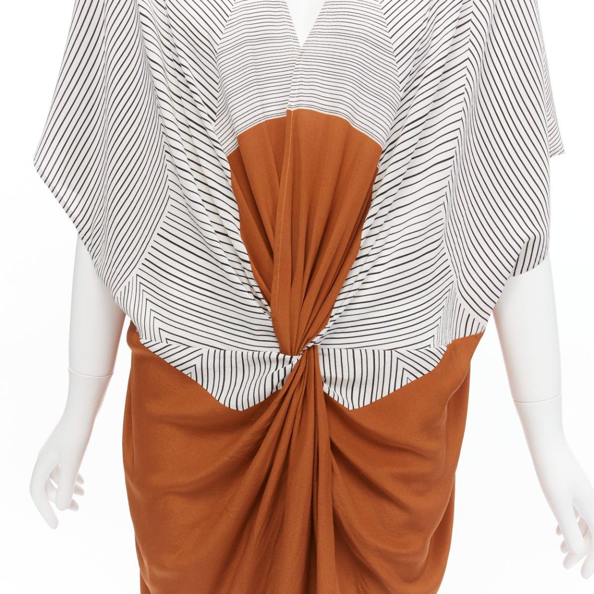 ERES 100% silk black white striped brown colorblocked knot coverup tunic  S
Reference: SNKO/A00423
Brand: Eres
Material: Silk
Color: Black, Brown
Pattern: Pinstriped
Closure: Pullover
Extra Details: Tent tunic.

CONDITION:
Condition: Excellent, this