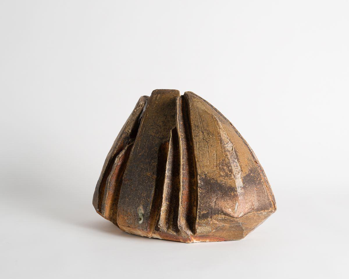 Unique piece
Signed: Astoul.

Master ceramicist Eric Astoul created this piece as part of a series inspired by both modern and ancient stoneware, which, with its rough firing, flips the traditional ceramic craft known to La Borne on its head.