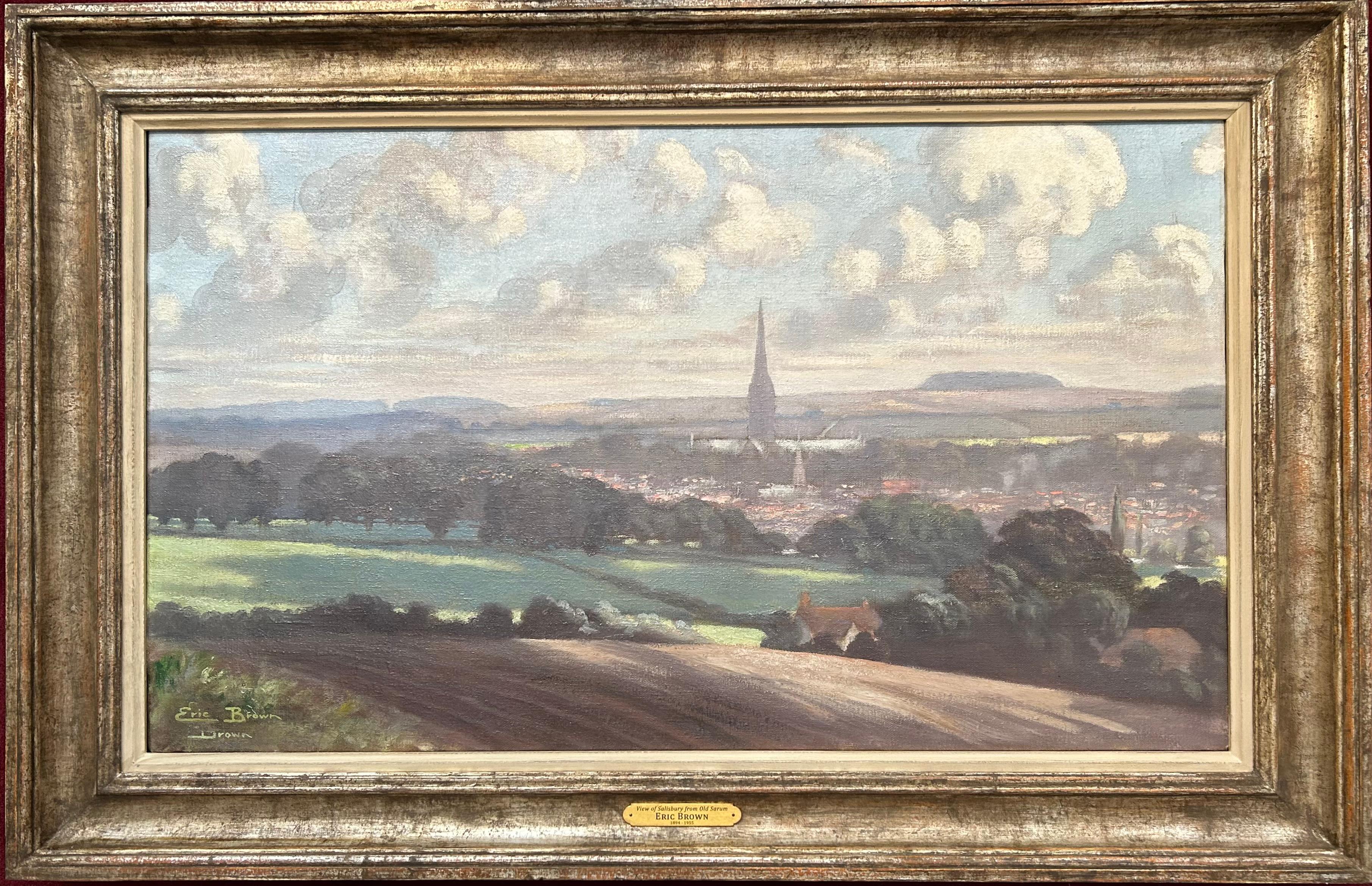 Eric Brown
Vista di Salisbury da Old Sarum
Olio su tela, firmato in basso a sinistra
Dimensioni dell'immagine: 21 x 36 ¼ pollici (53,5 x 92 cm)
Telaio in stile contemporaneo

In questa scena, Brown varia leggermente i suoi paesaggi e incorpora la