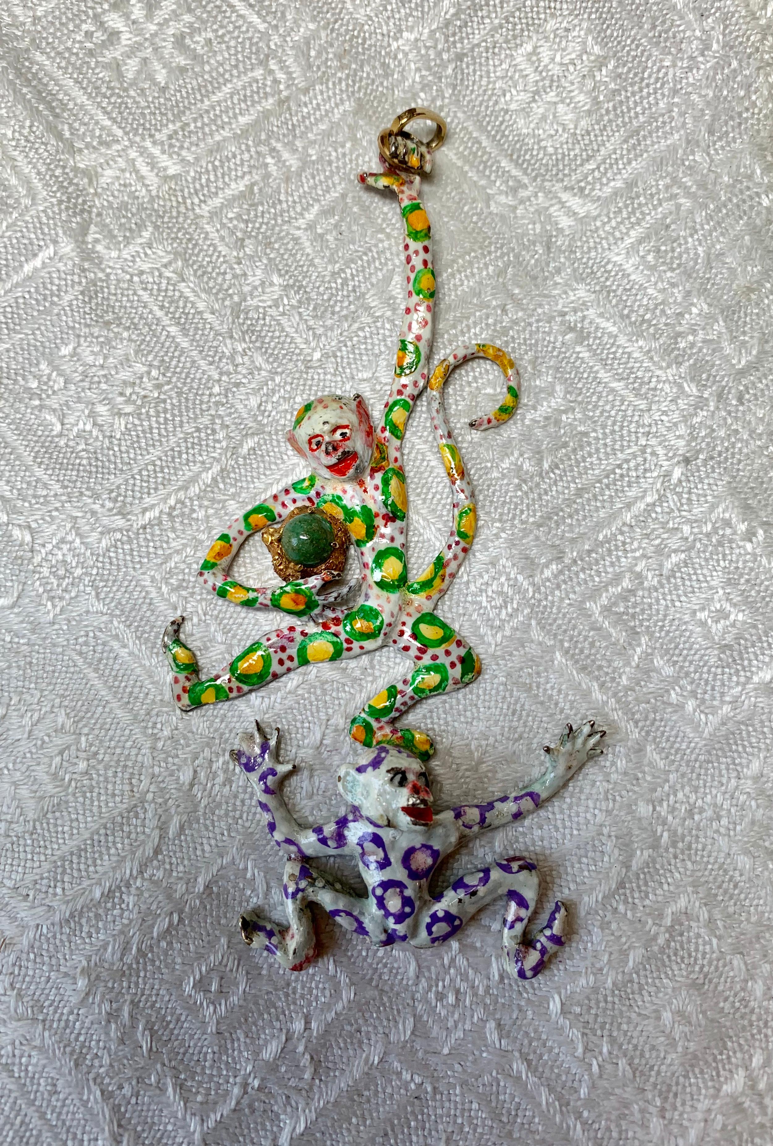 A spectacular piece of original jewelry art sculpture by famed Surrealist artist Eric de Kolb.  The pendant with two swinging monkeys is absolutely fantastic.  The monkeys are adorned with circle and dot motifs hand painted in polychrome enamel over